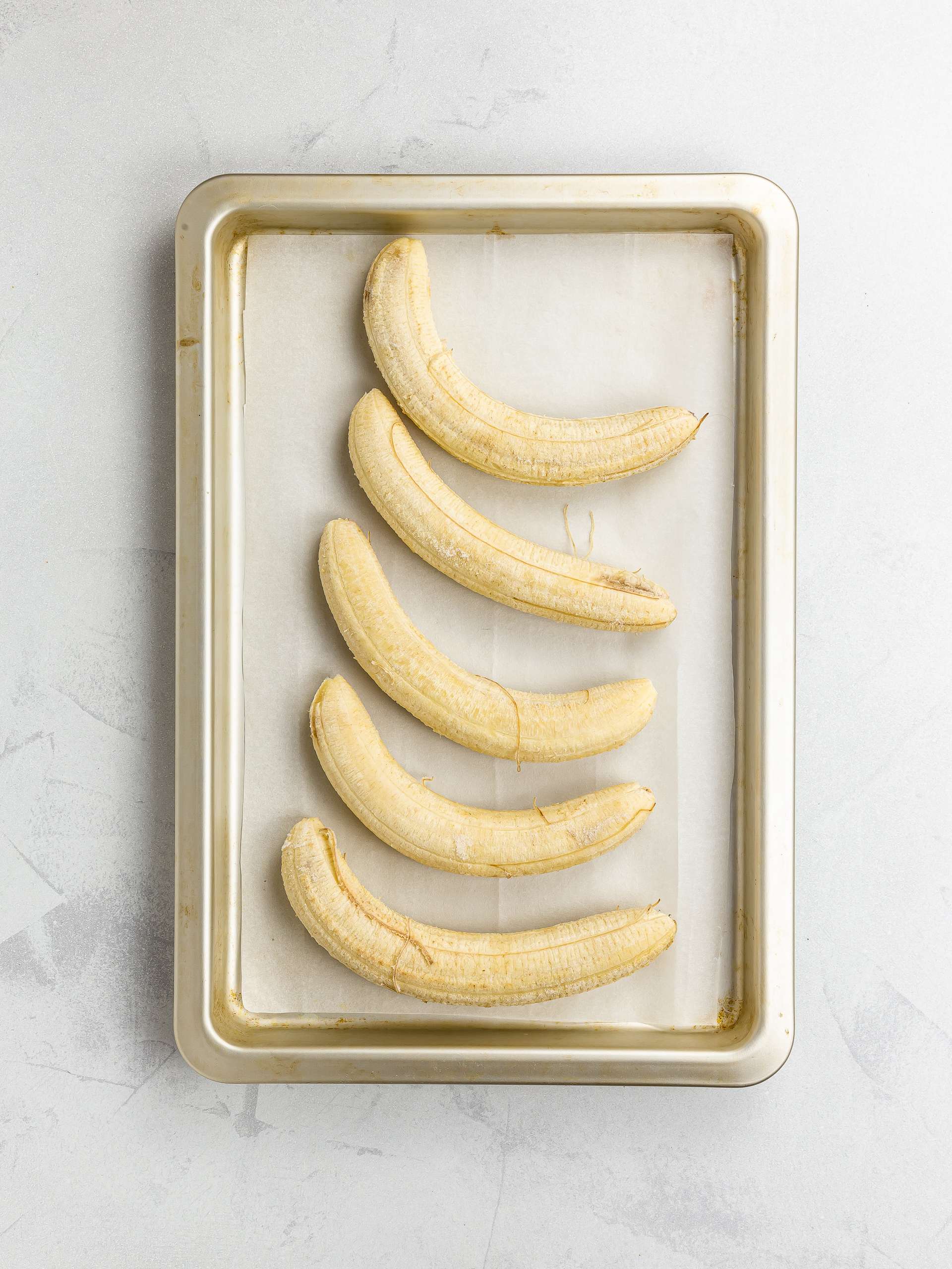 frozen bananas on a tray