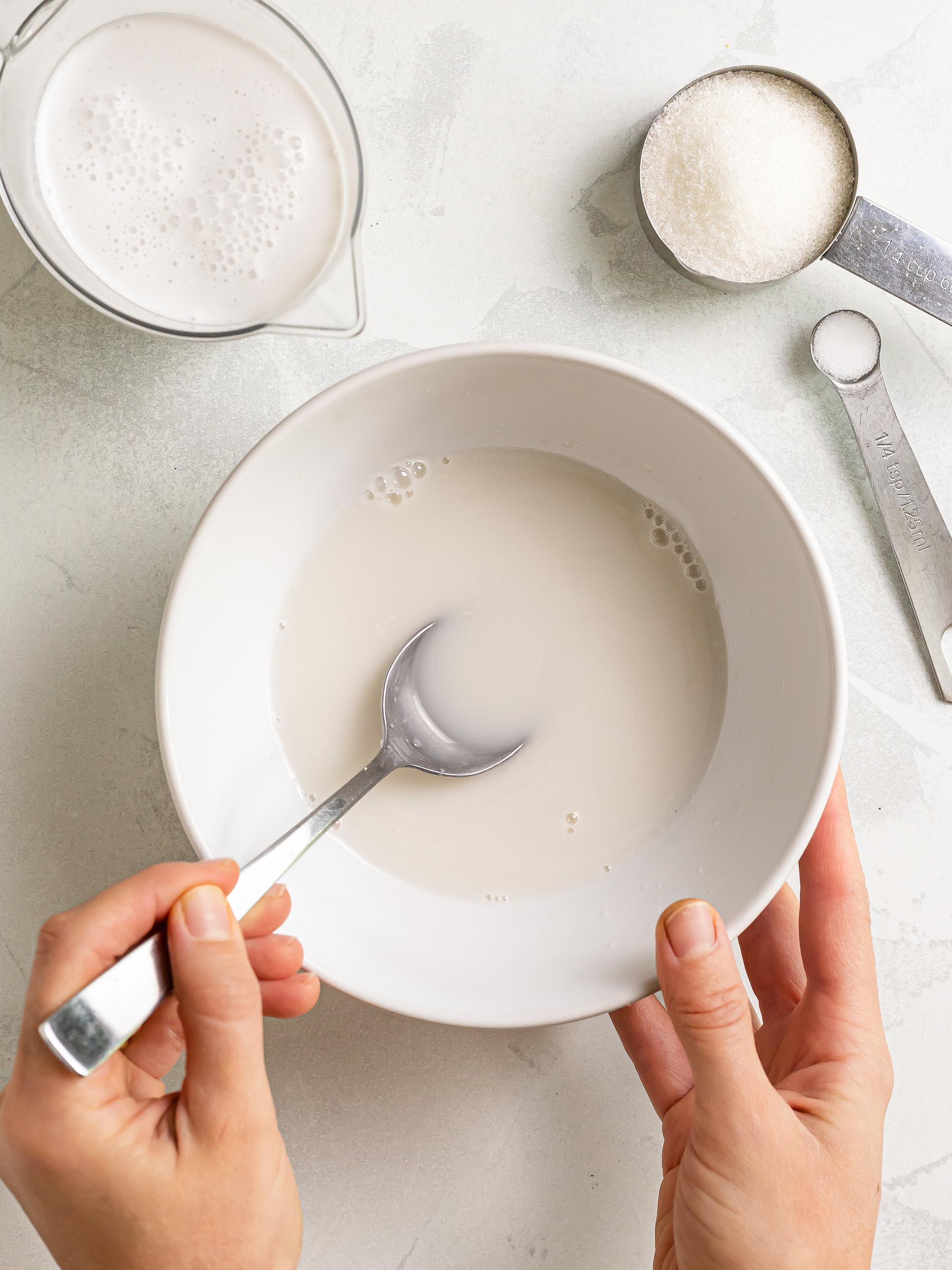 sugar dissolved in hot coconut milk in a bowl