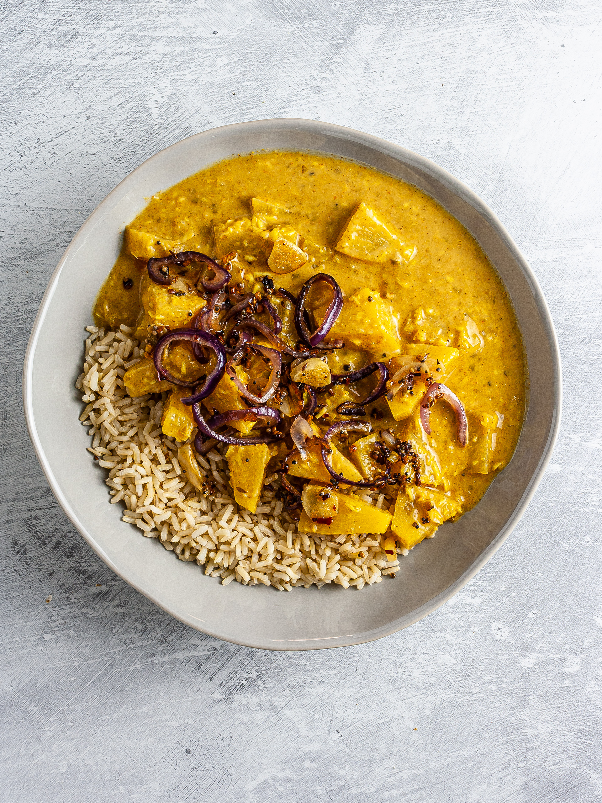 Pineapple pachadi curry with sautéed spices and rice.