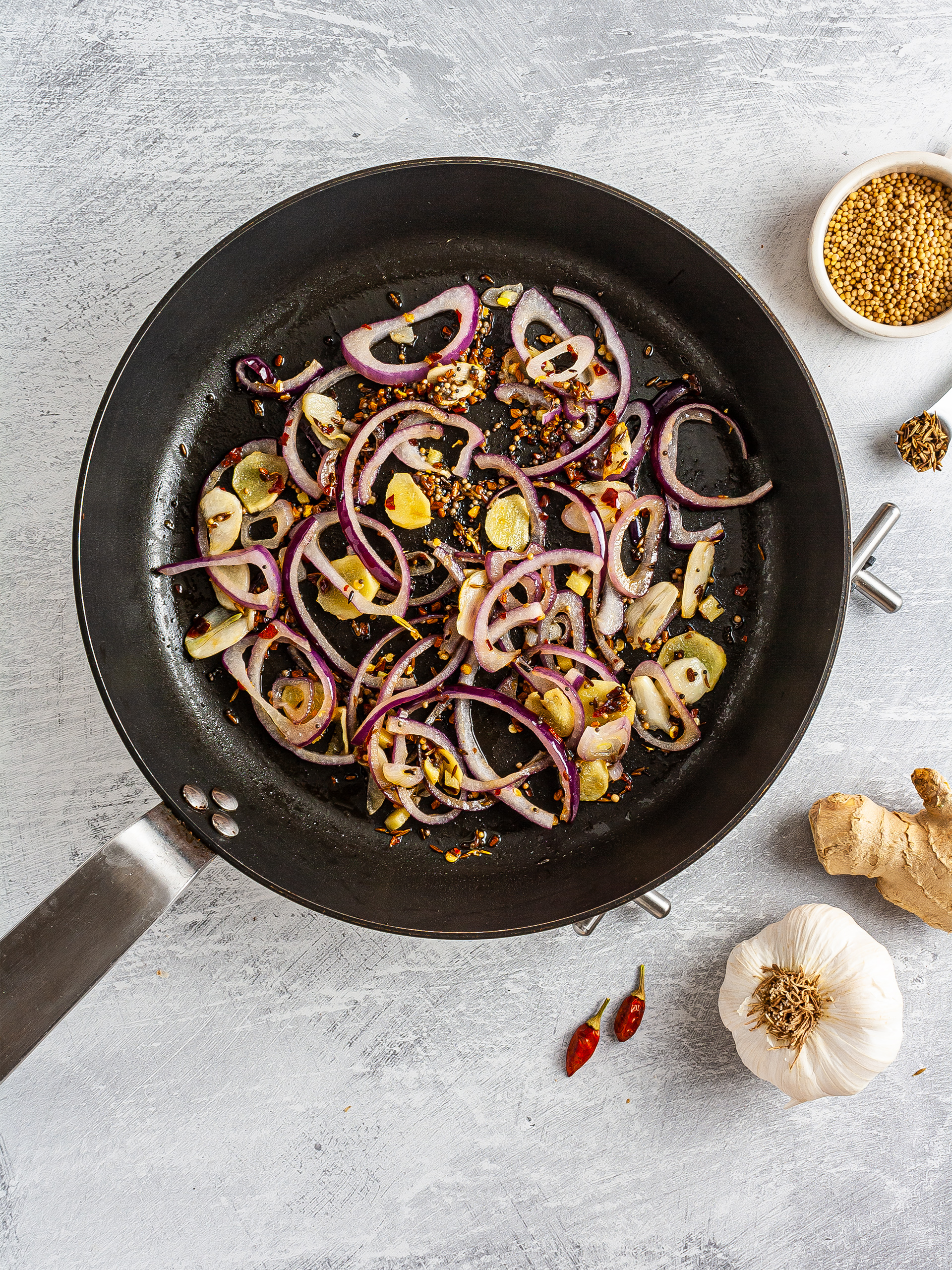 Spices sizzled with onions, garlic, and ginger