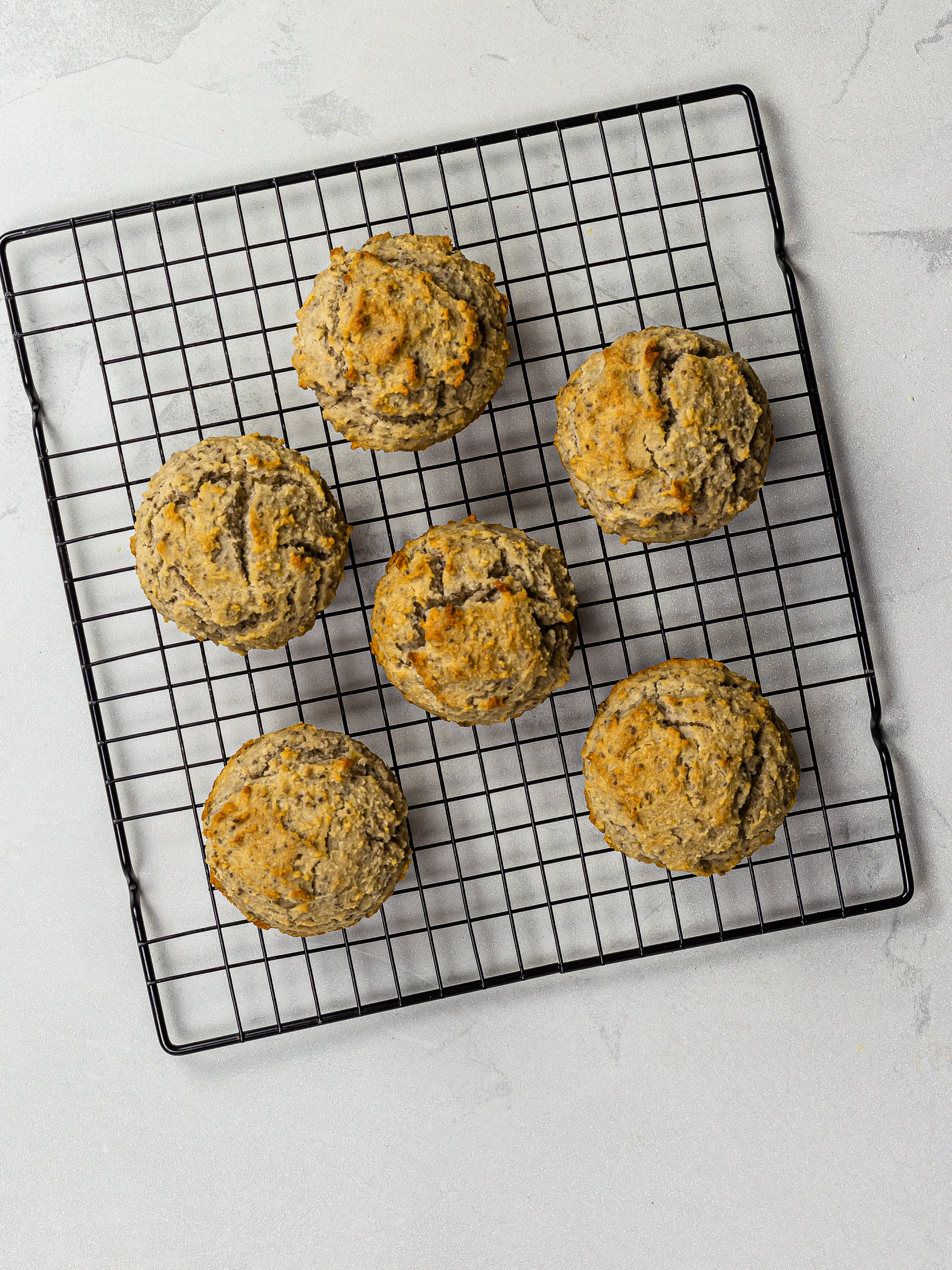 baked lemon chia muffins on a rack