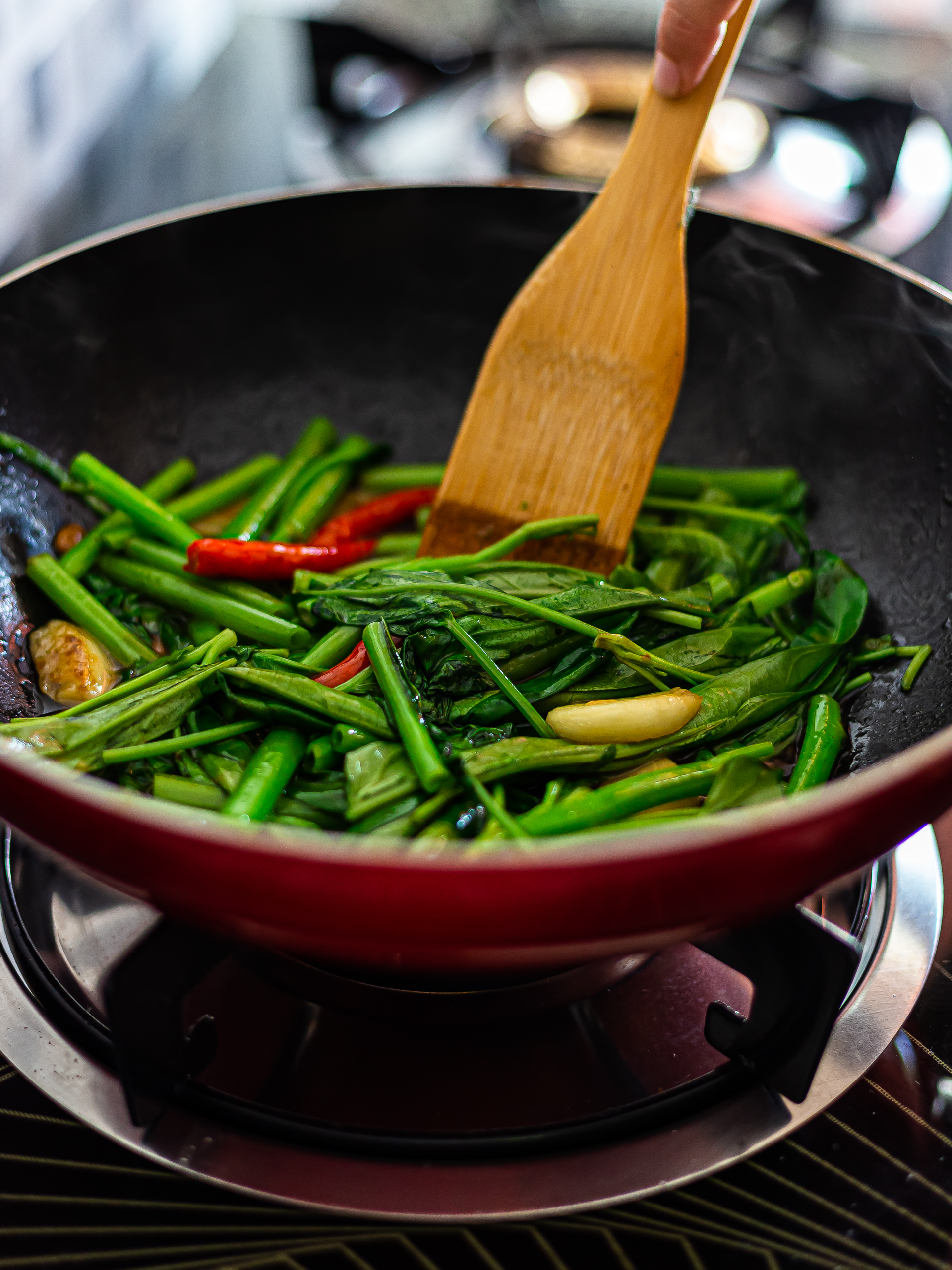 stir-fried thai morning glory in a skillet