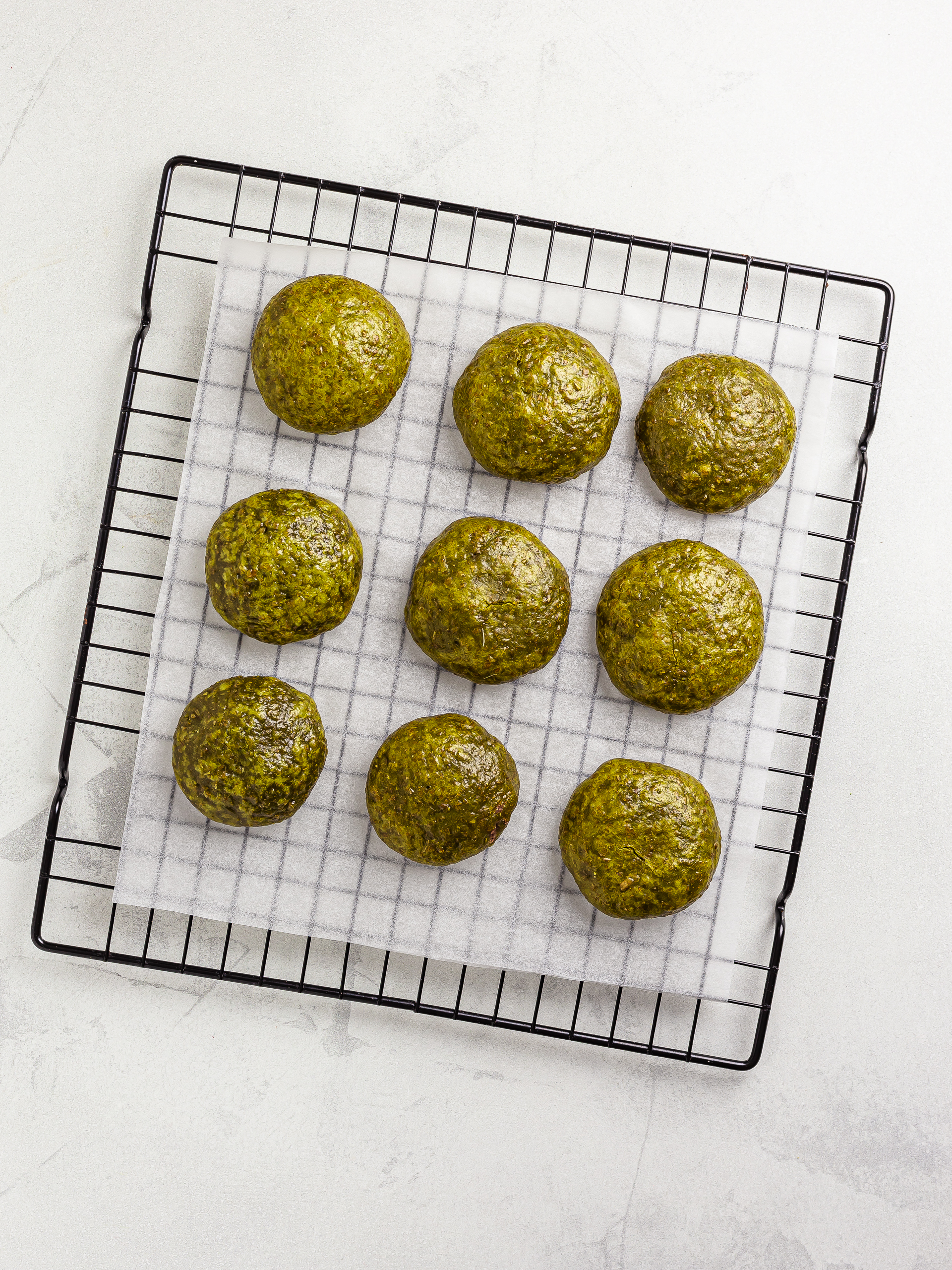 steamed matcha manju cooling down on a wire rack