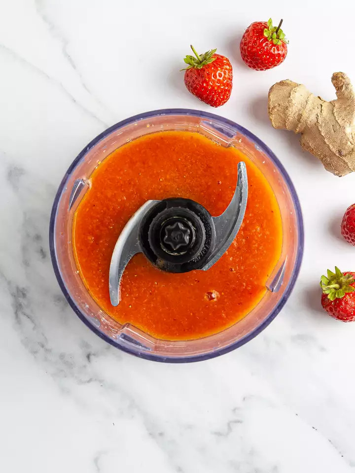 Blended carrots, strawberries, and ginger