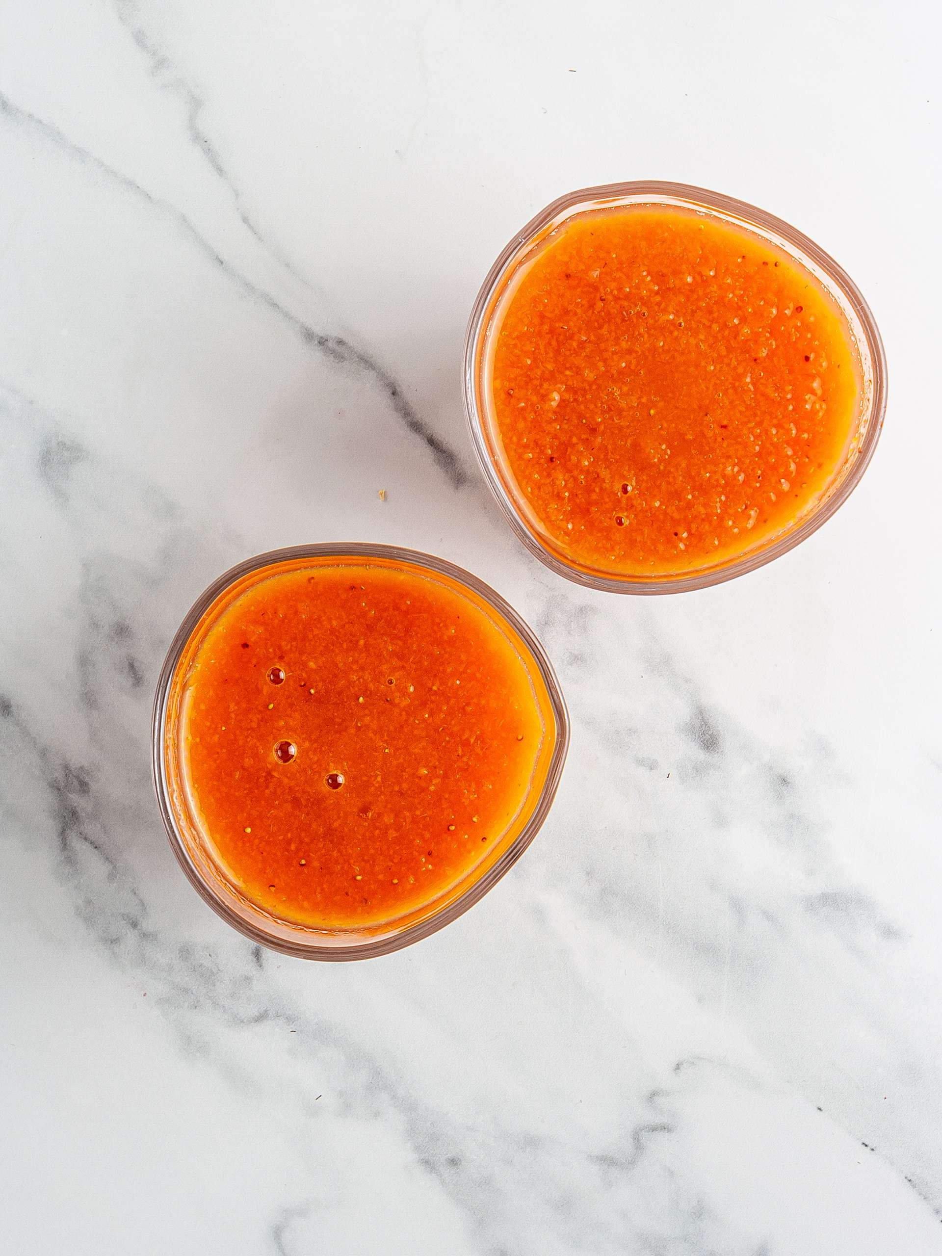 Carrot strawberry smoothie in glasses