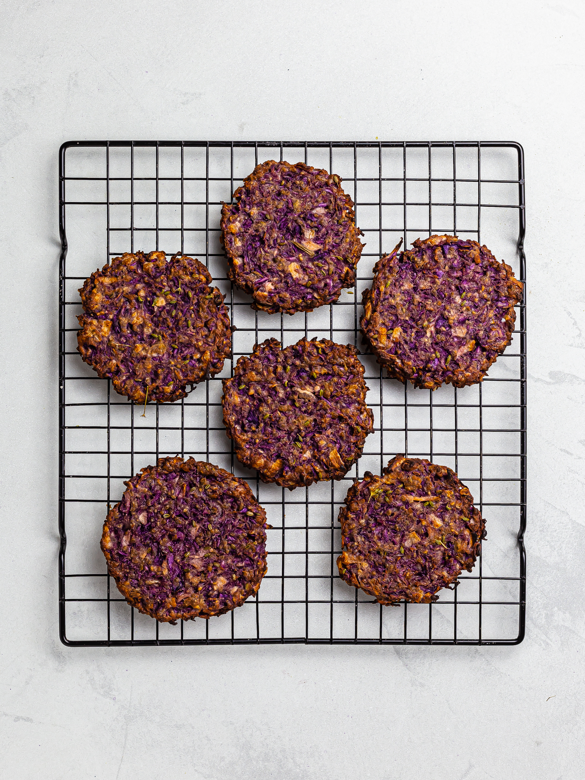 oven-baked red cabbage fritters on a rack