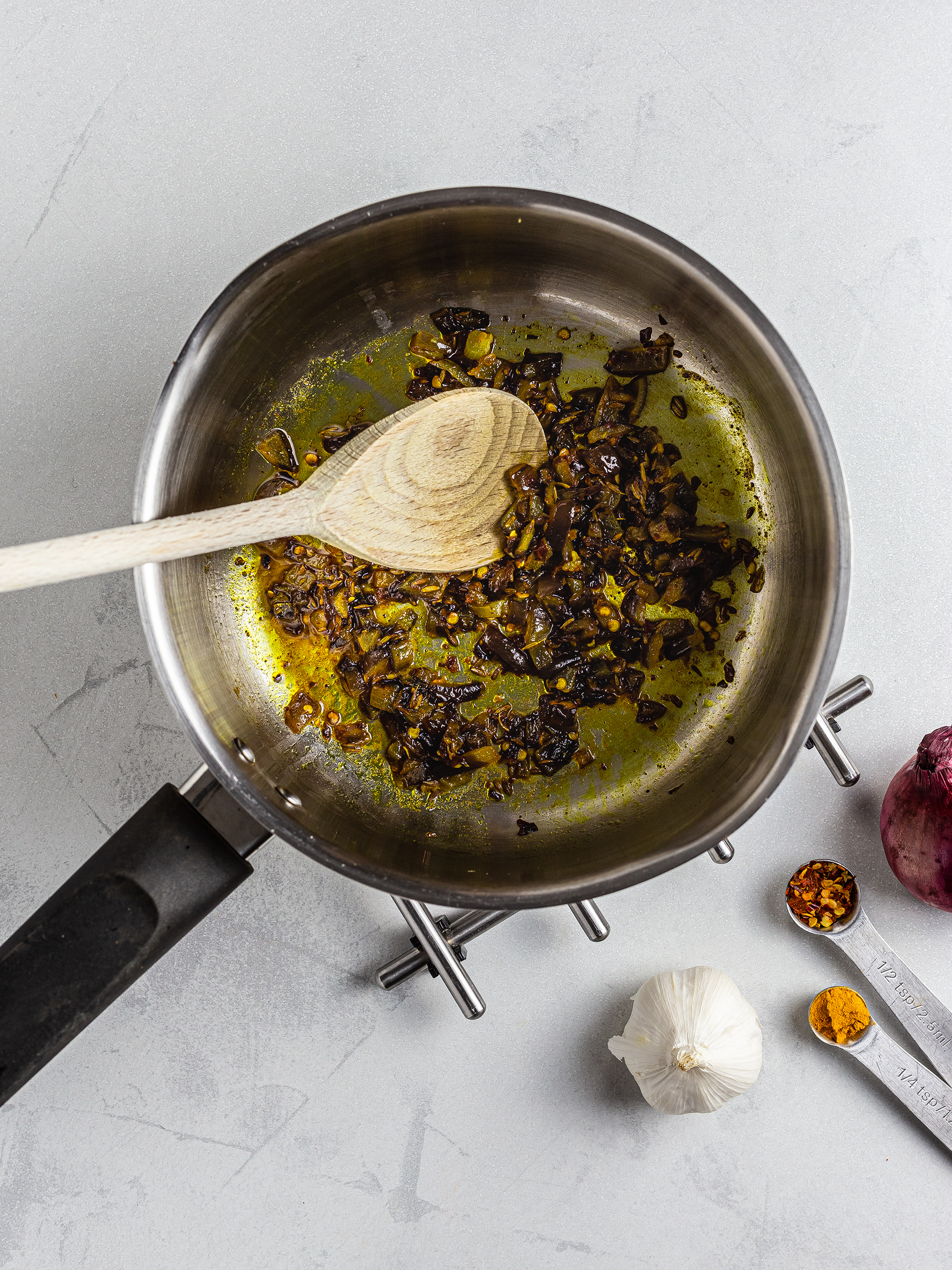 Onion and garlic sizzled with turmeric and chillies