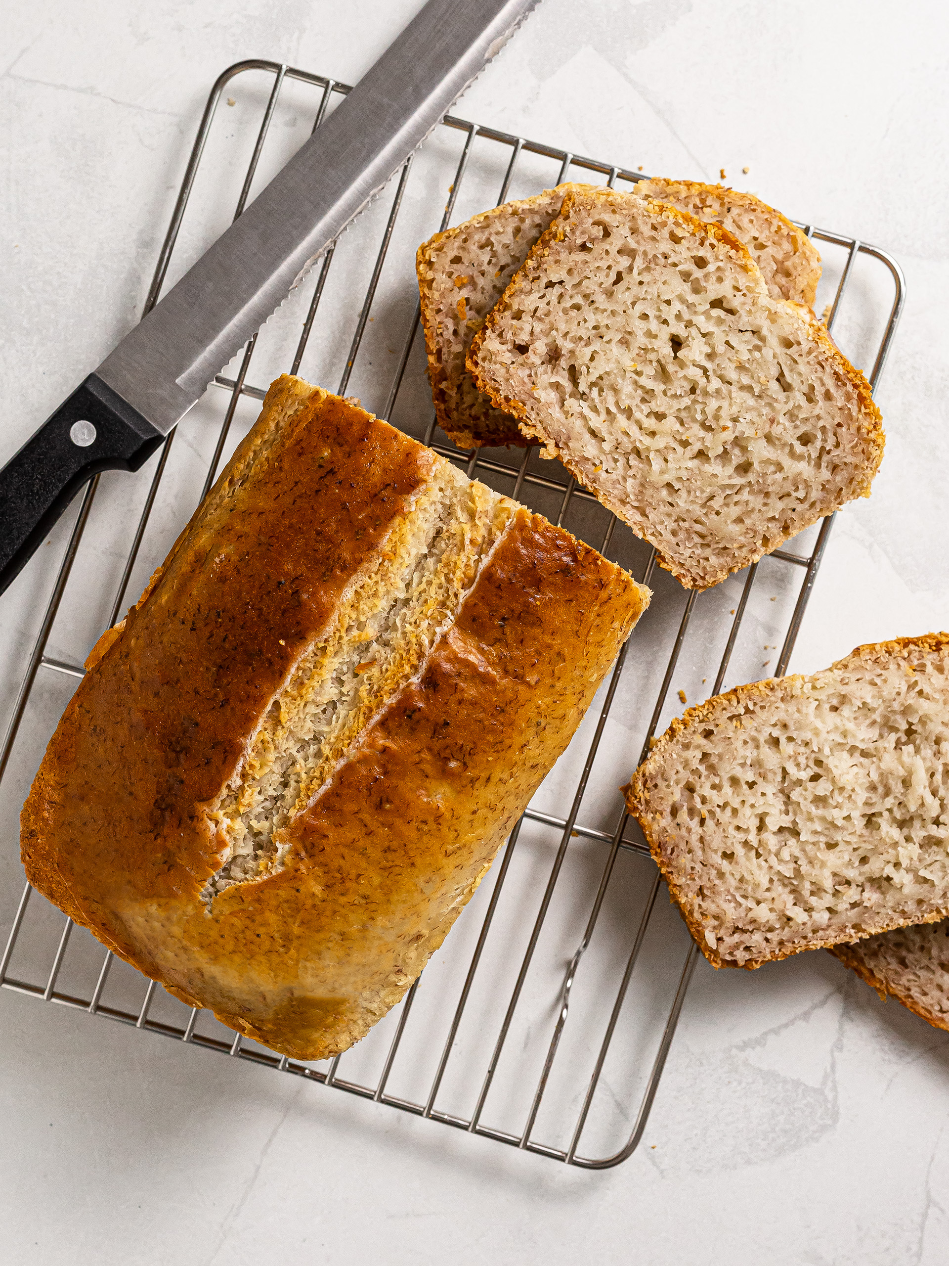 baked and sliced mochi banana bread on a rack