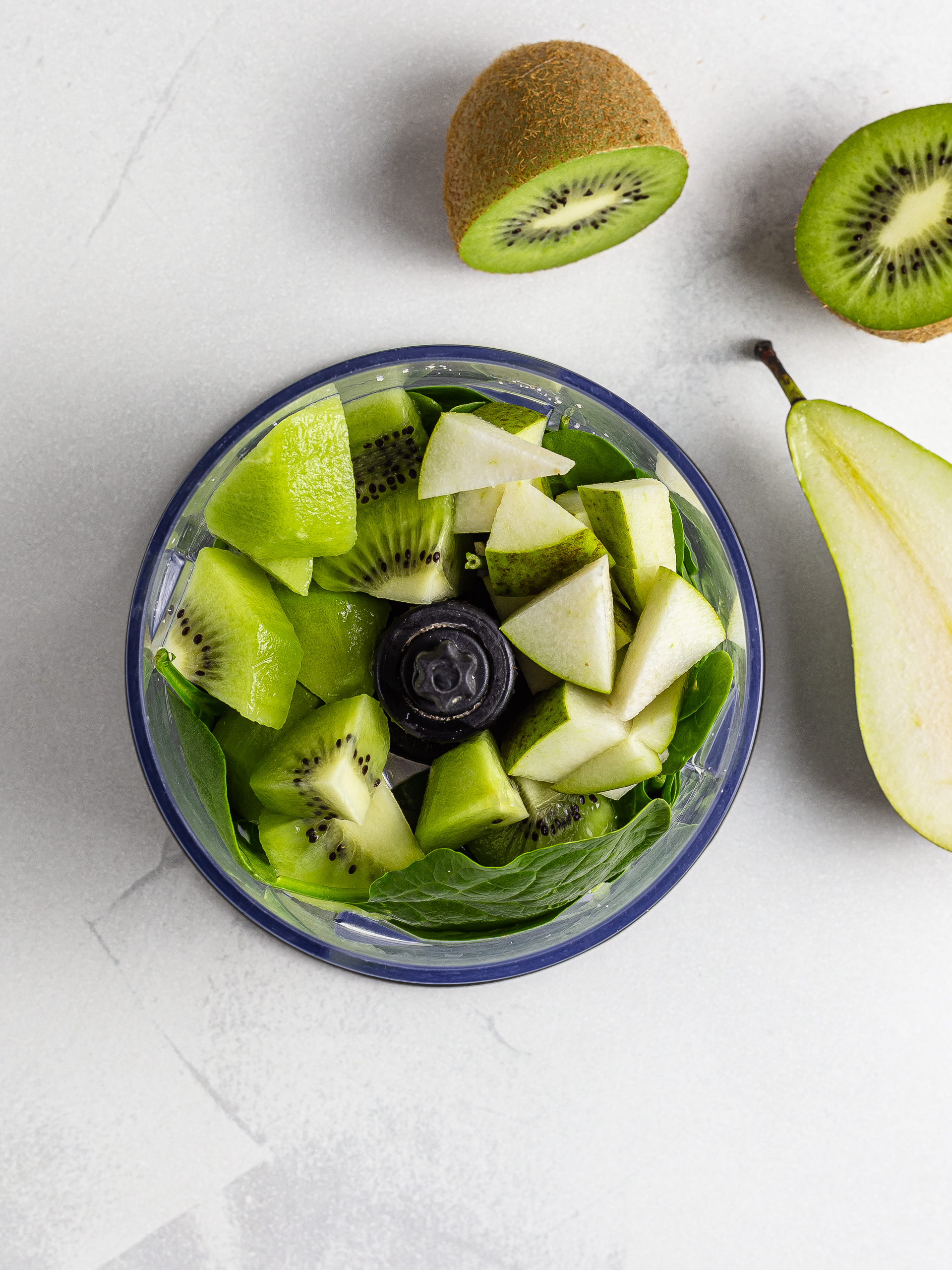 Kiwi spinach and pear in a blender