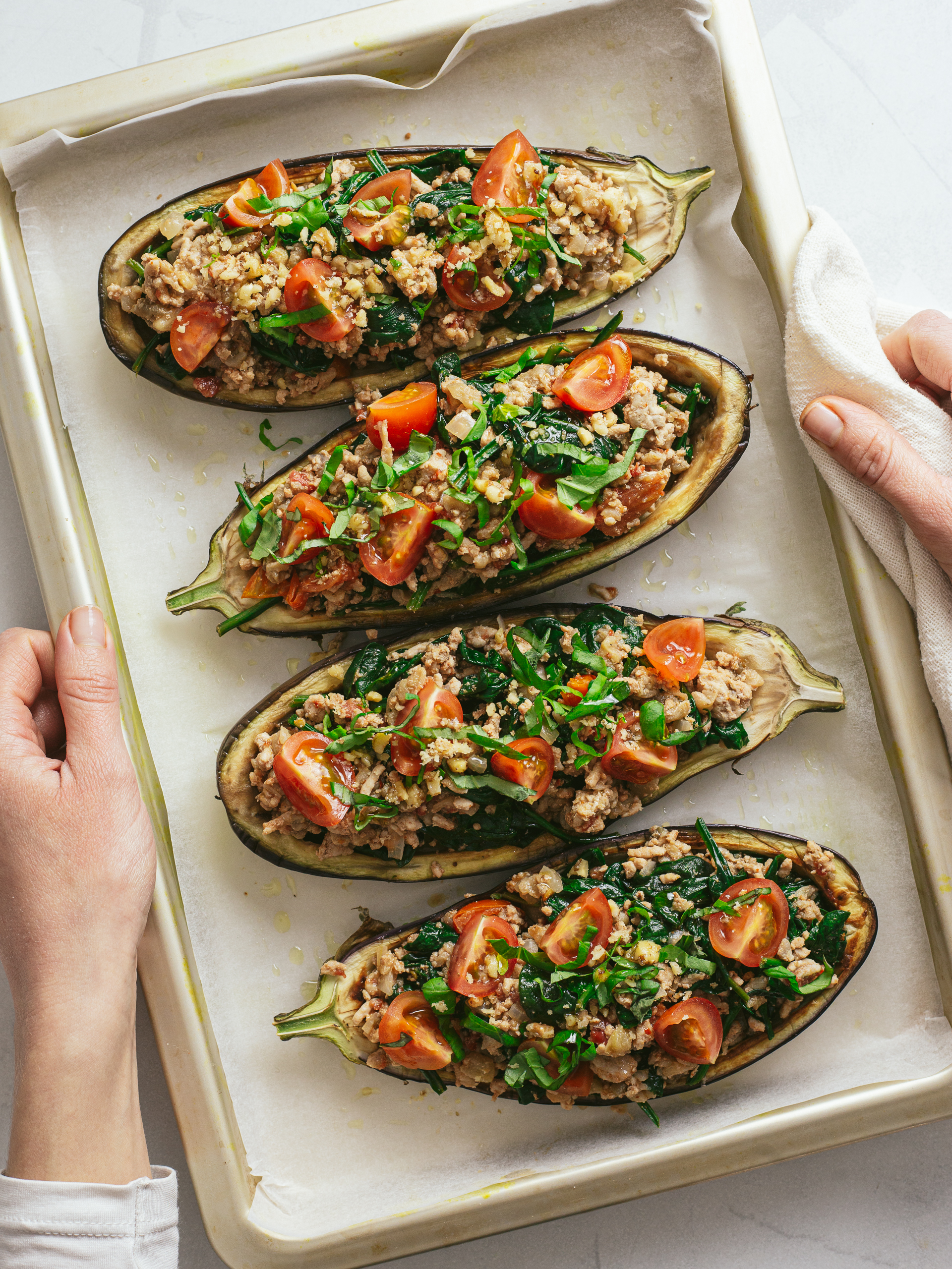 eggplant stuffed with mince, spinach, and tomatoes