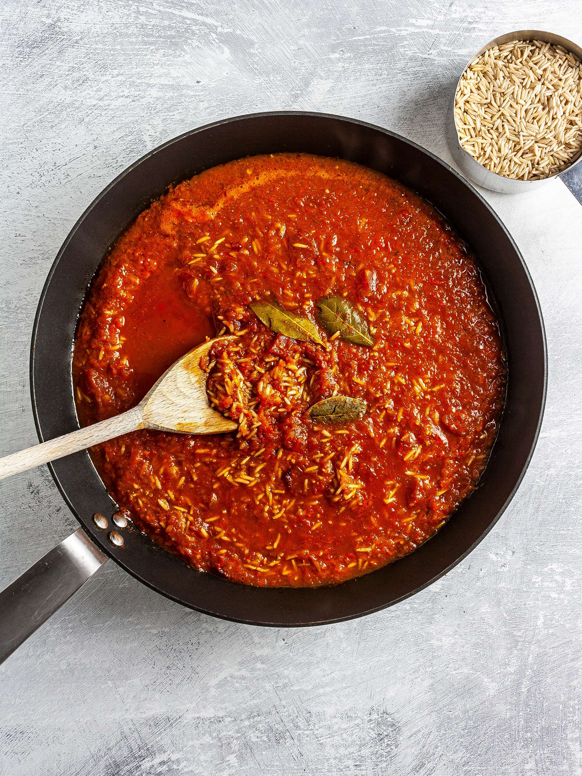 Rice cooking in tomato sauce