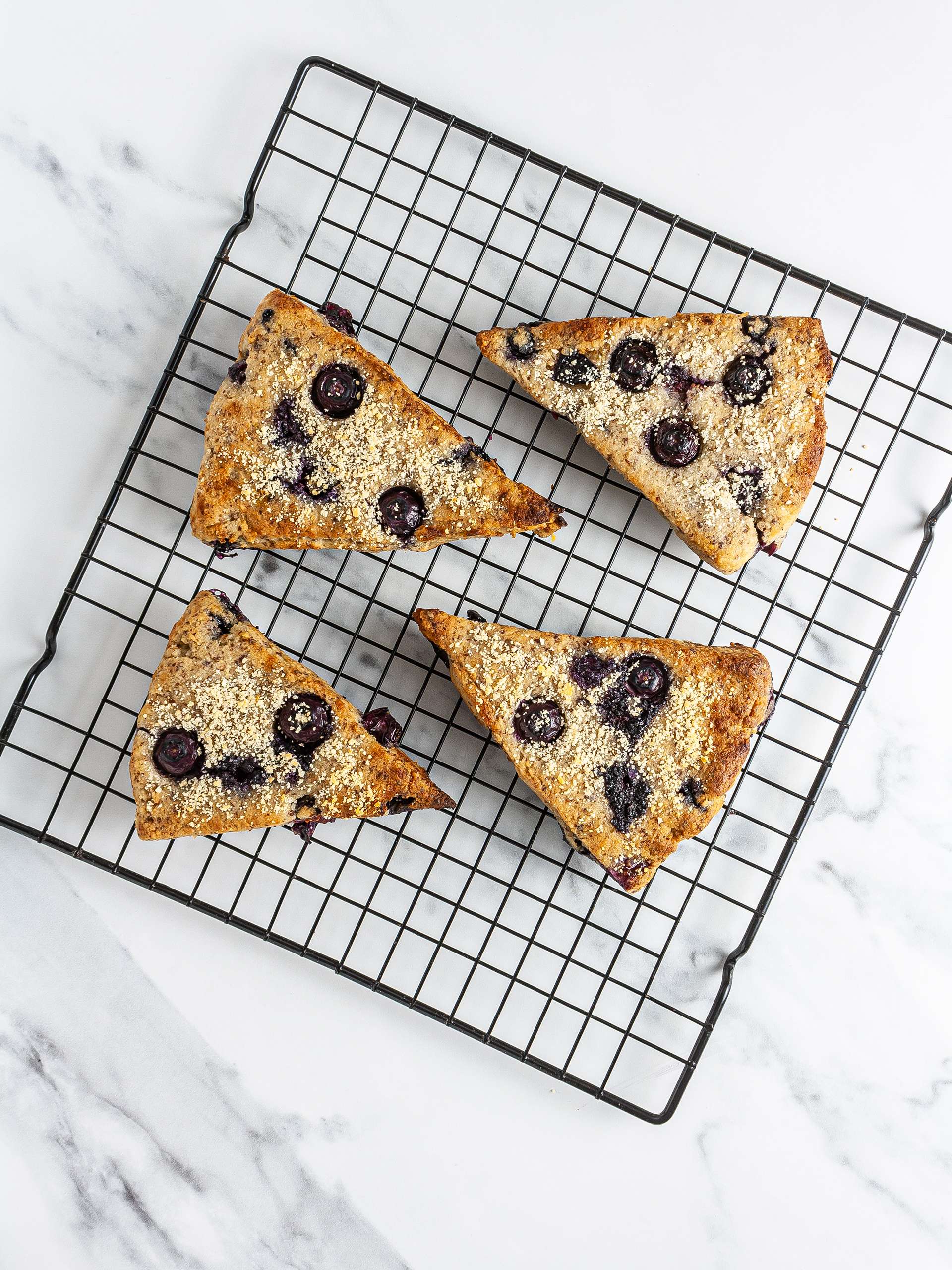 Baked blueberry scones on a cooling tray