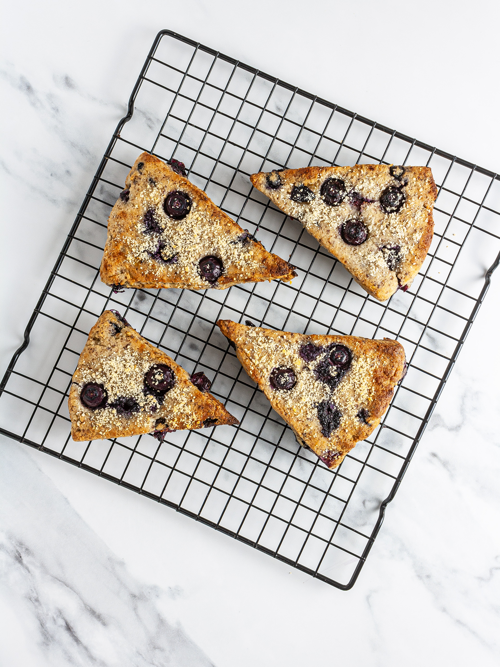 Baked blueberry scones on a cooling tray