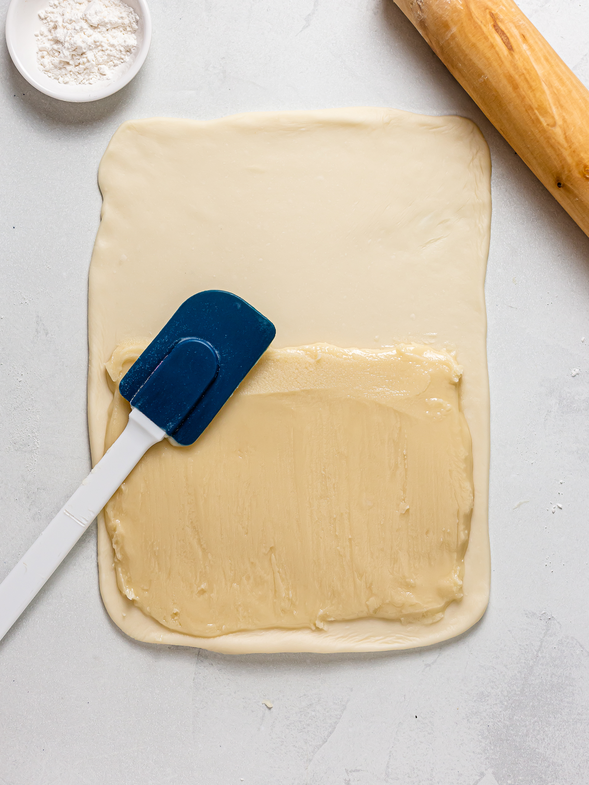 oil dough spread over base dough for hopia