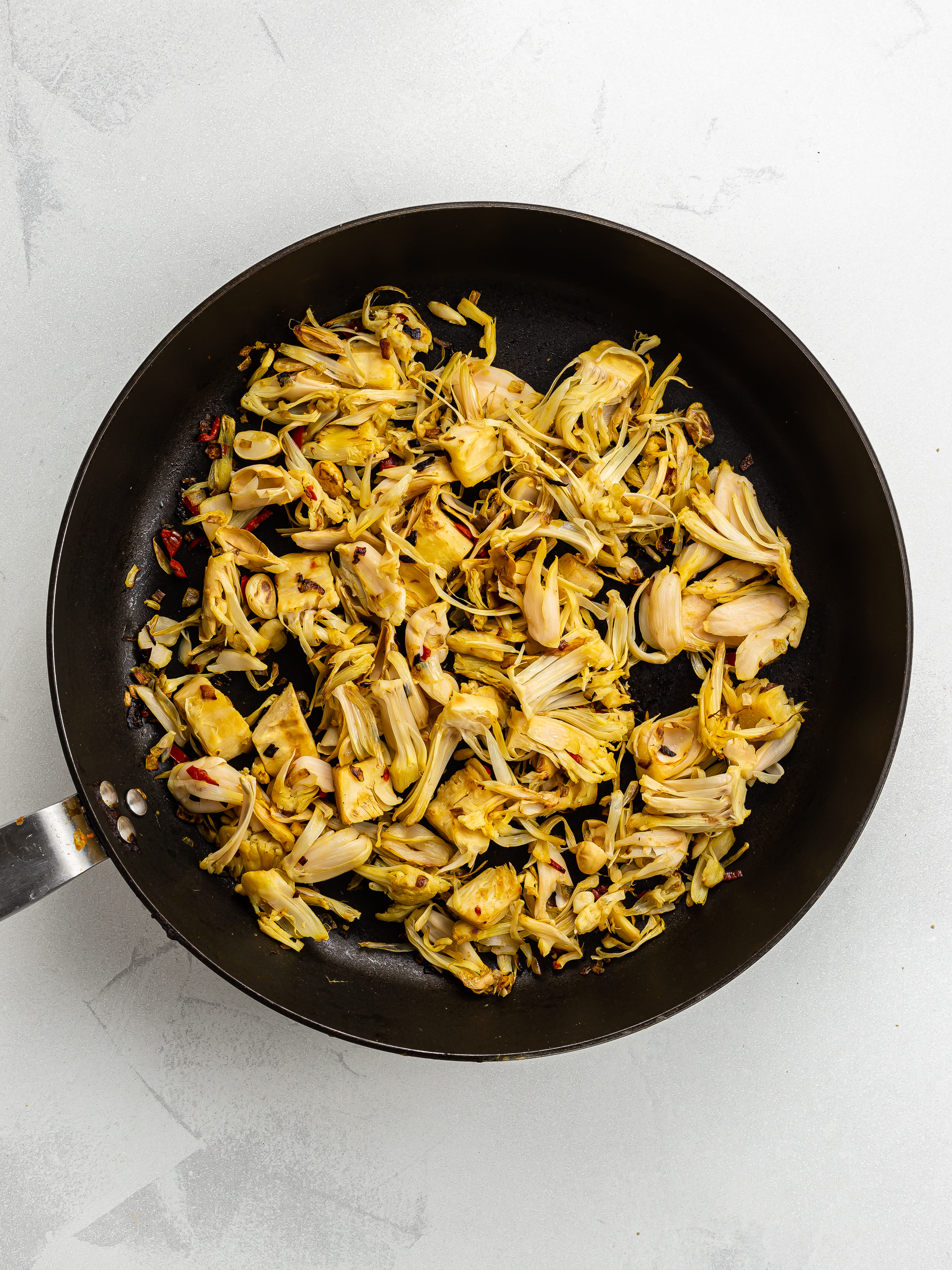 cooked pulled jackfruit in a skillet