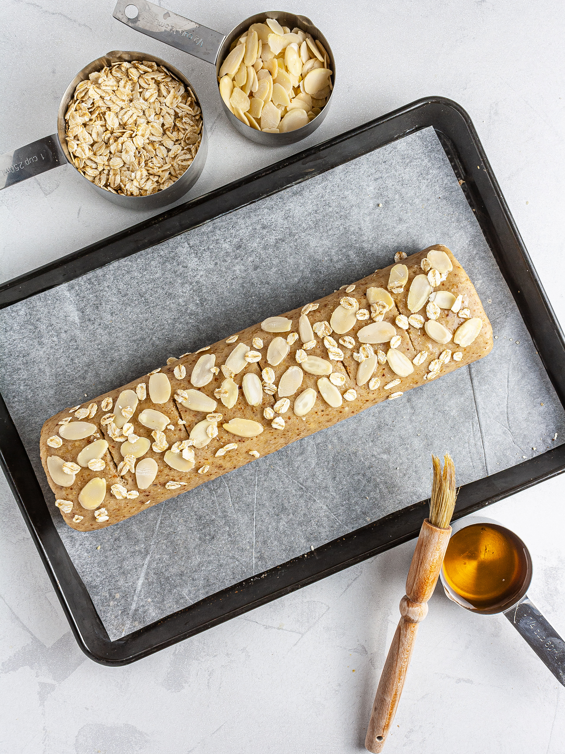 Rolled up strudel garnished with almond flakes