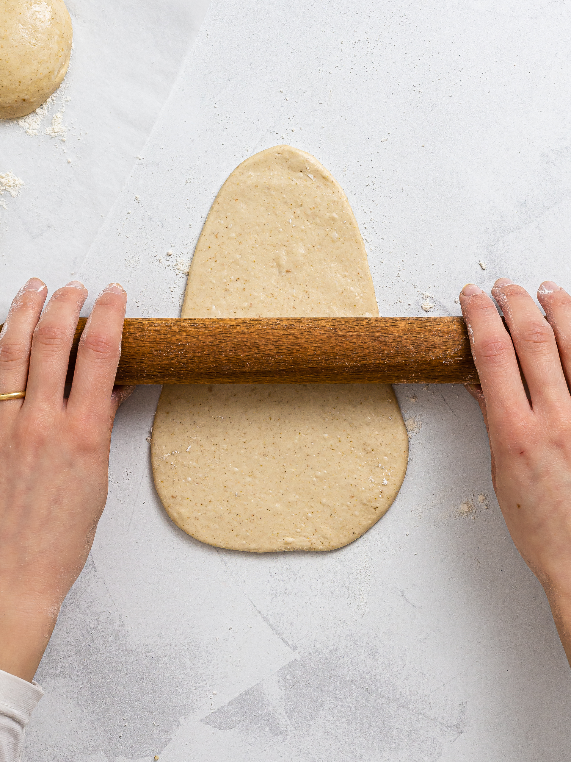 woman shaping sourdough naan flatbread