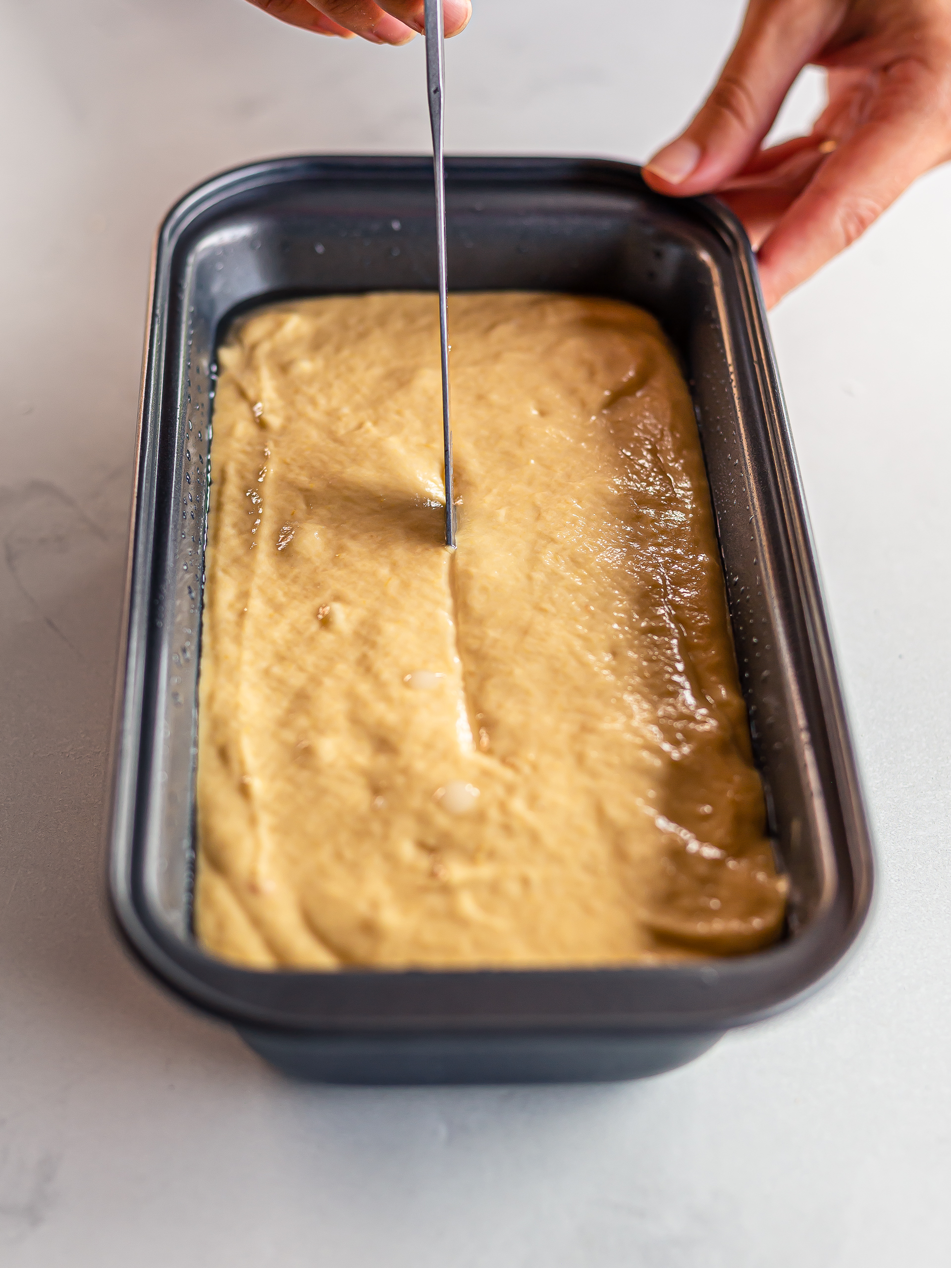 jackfruit cake batter in a loaf tin