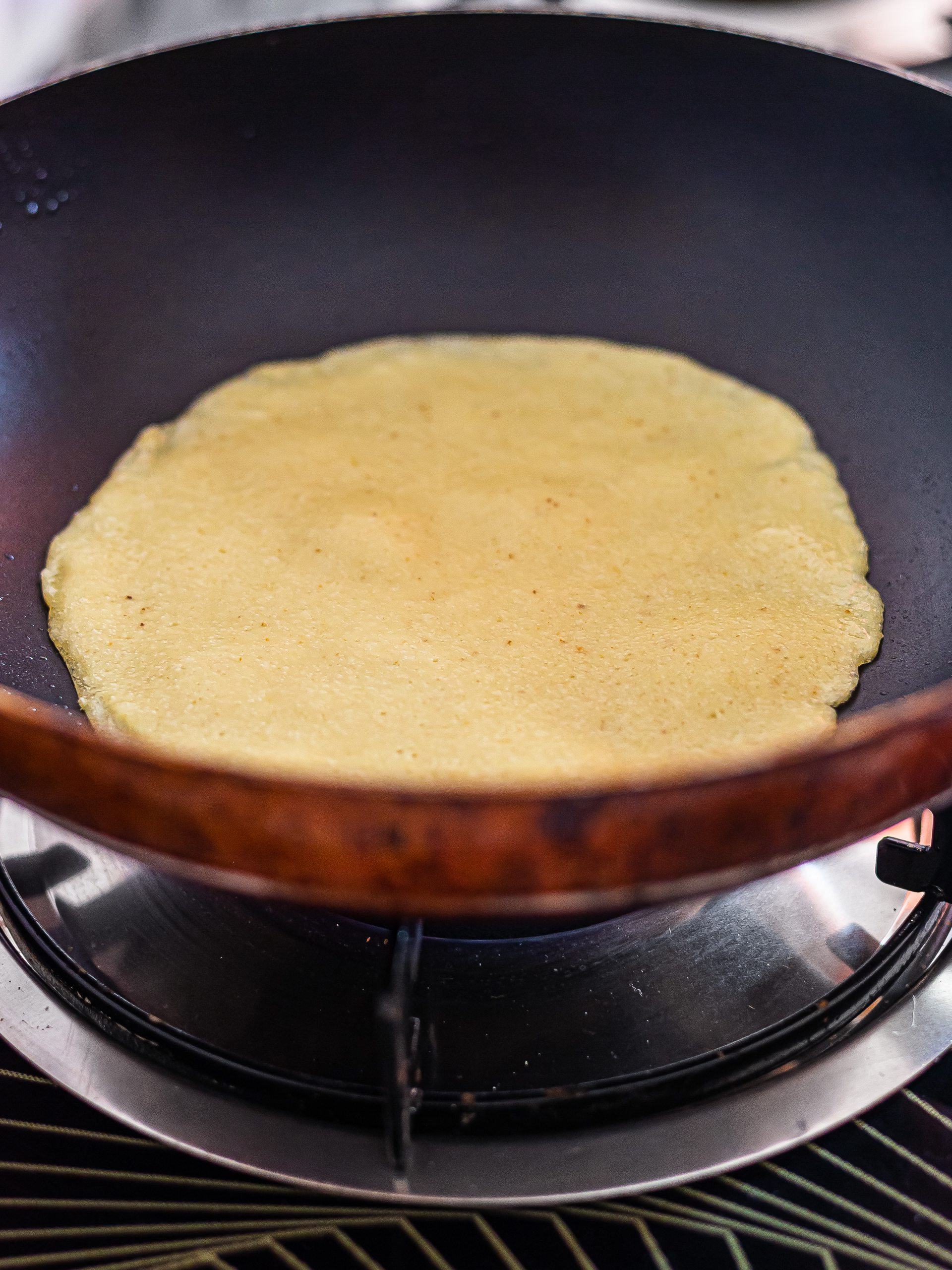 vegan pancake crepe cooking in a skillet