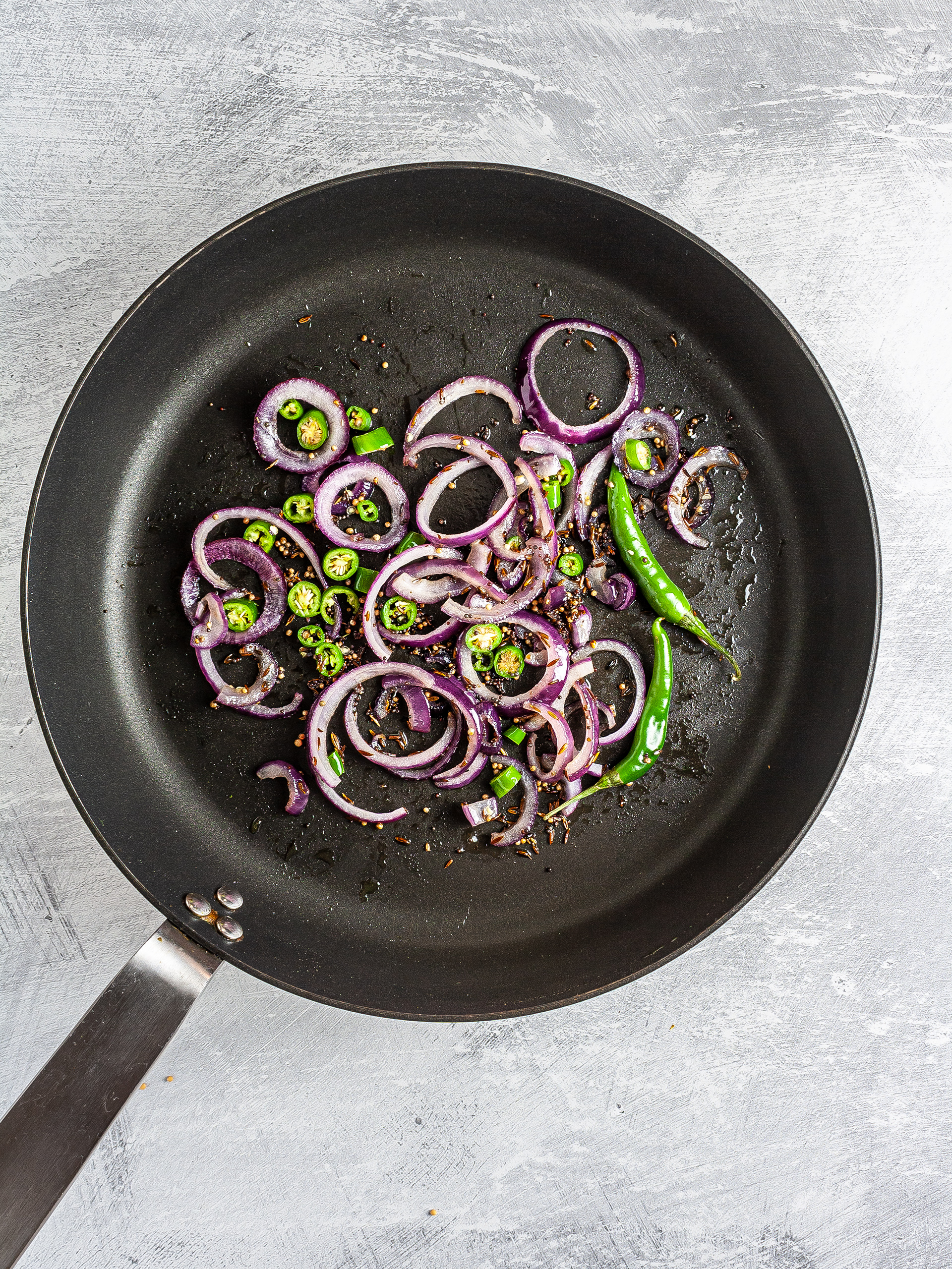 Onion and chillies sizzled with mustard and cumin seeds