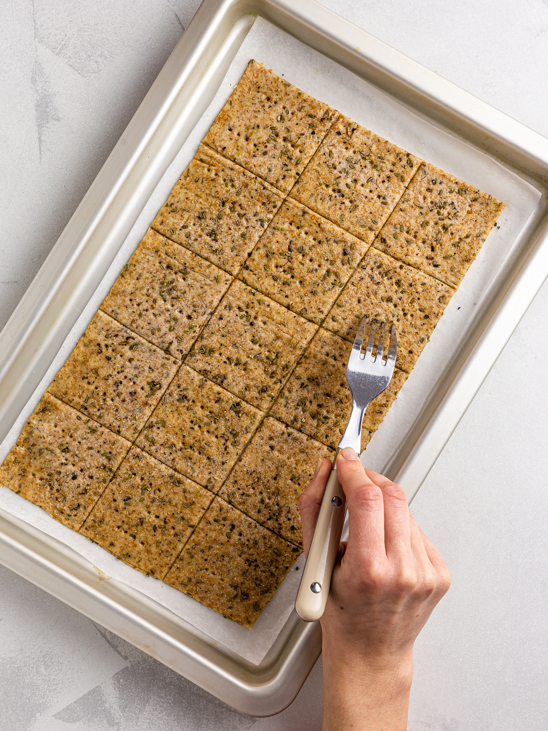 cut crackers shapes pricked with a fork