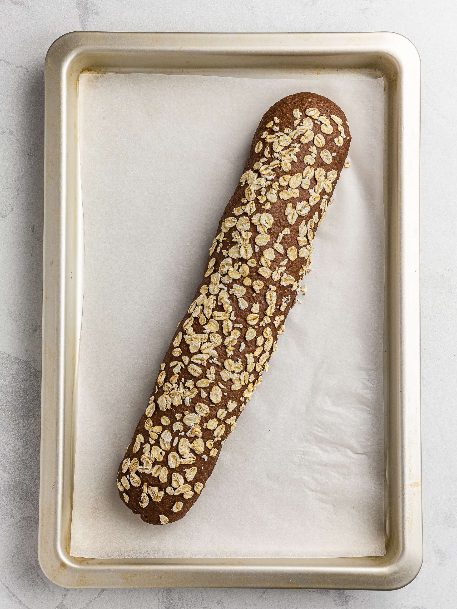 proved brown baguette with oats