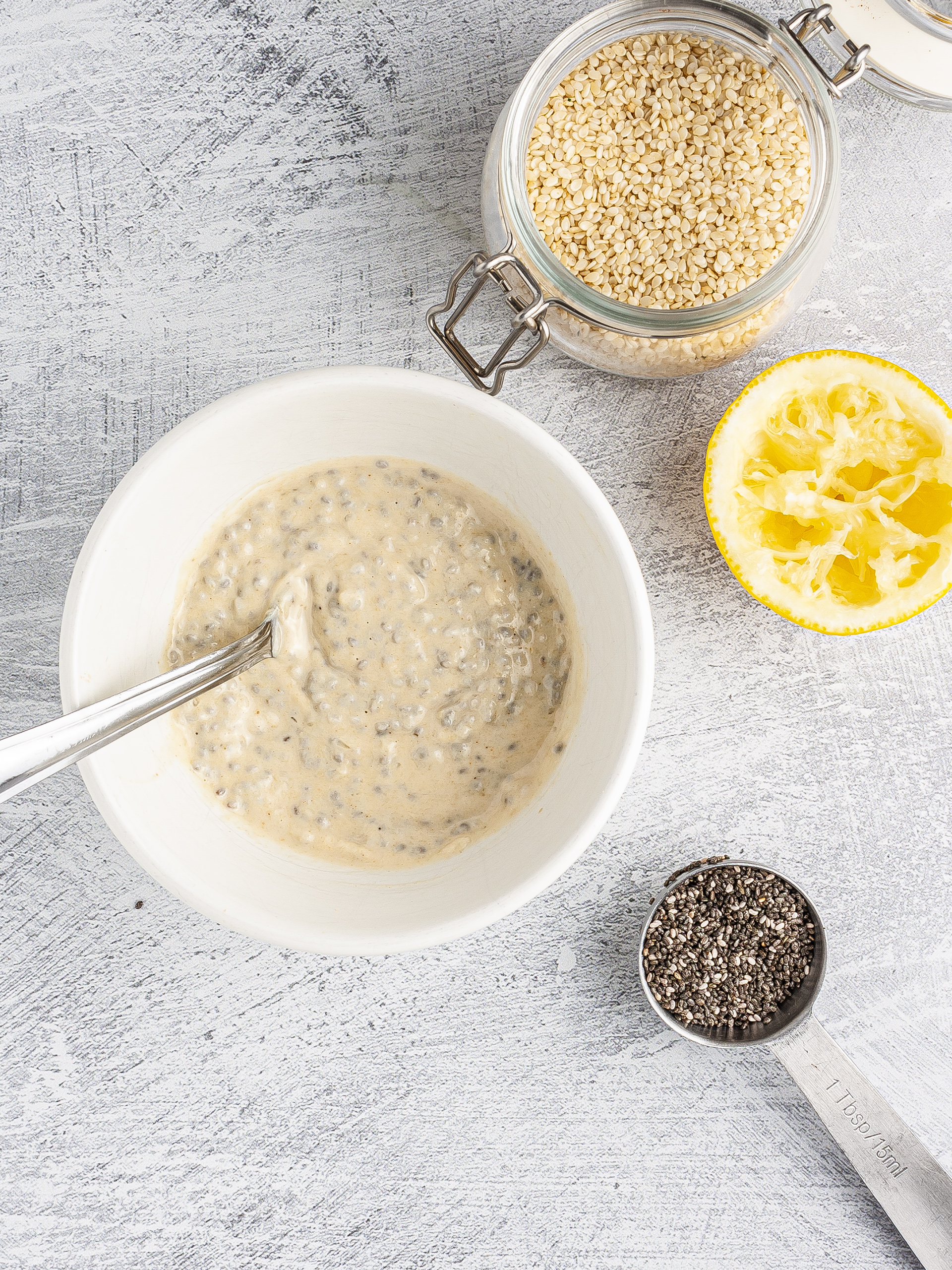 Dressing with tahini, lemon, and chia seeds.