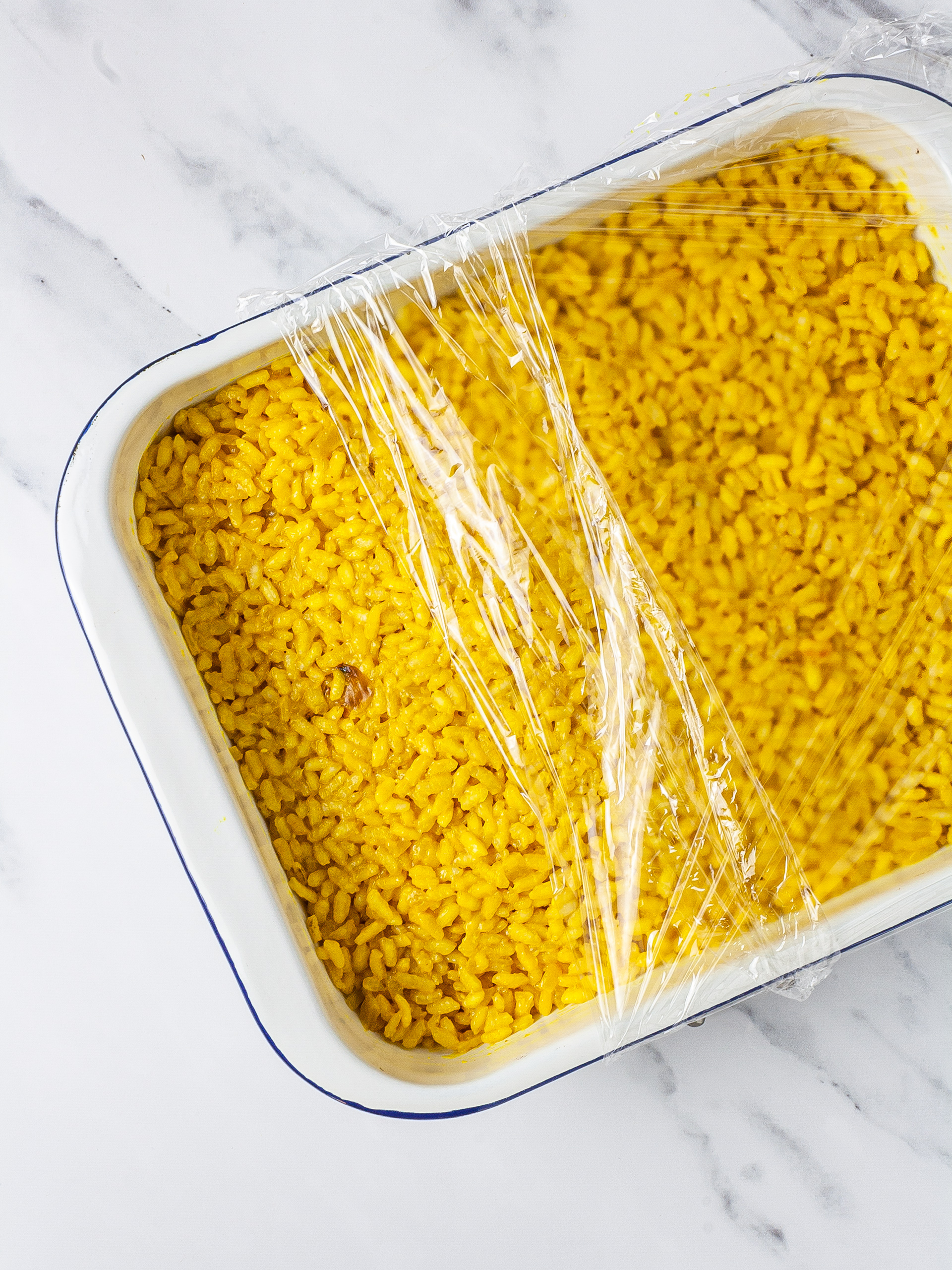 Arancini rice cooling in a tray.