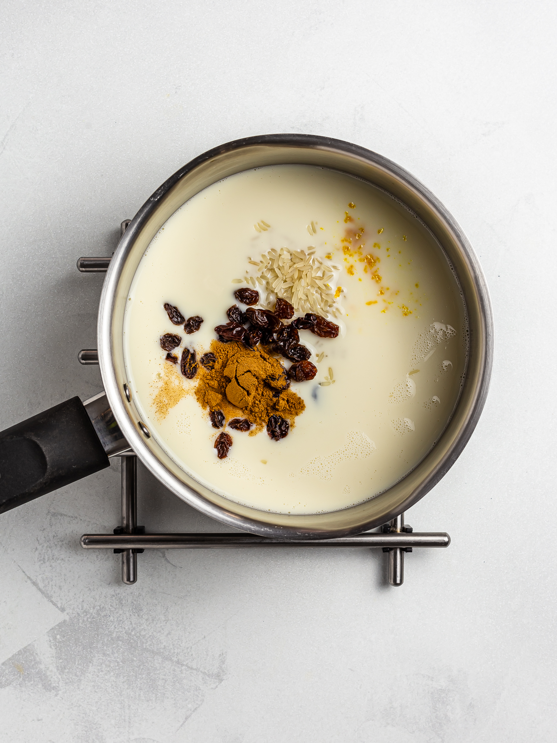 coconut milk with rice, raisins and cinnamon for pudding