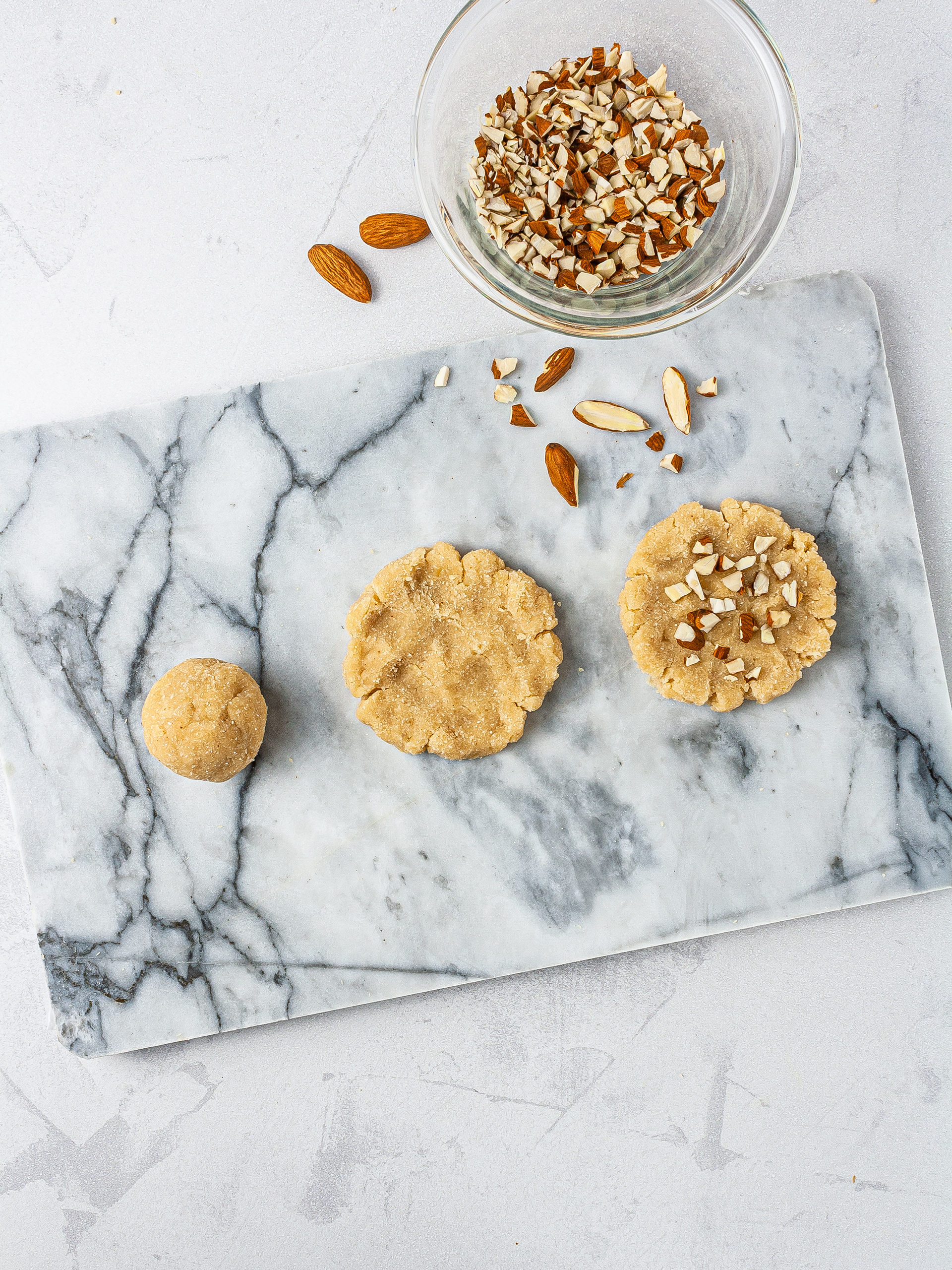 Almond cream cheese cookies on chopping board.