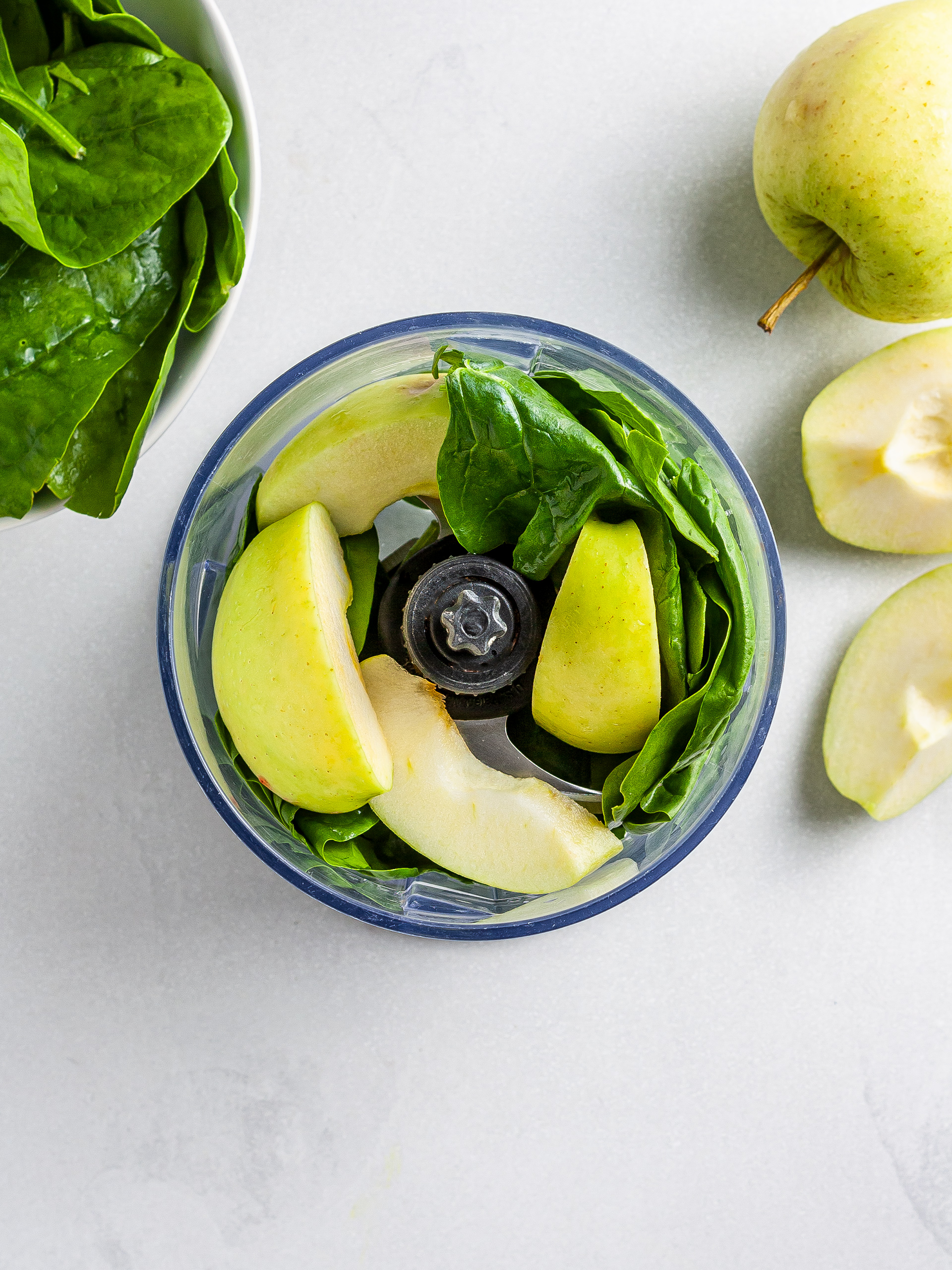 Apples and spinach in food processor