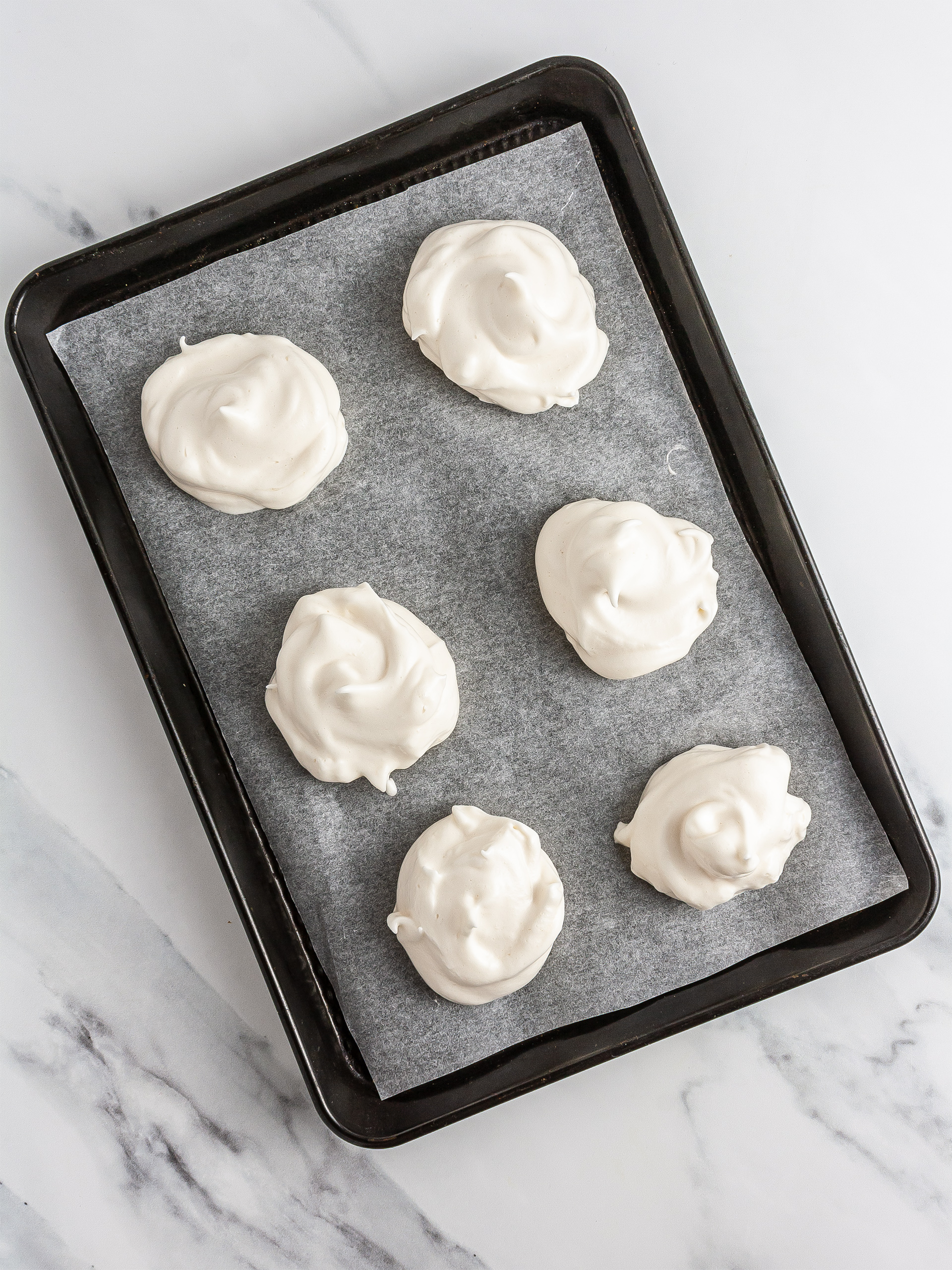 Meringues on a baking tray