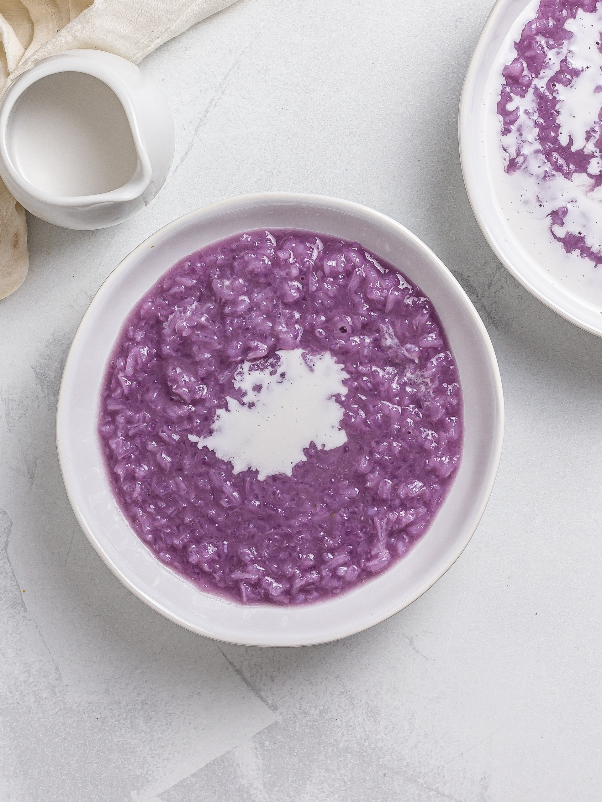 ube champorado served with coconut milk