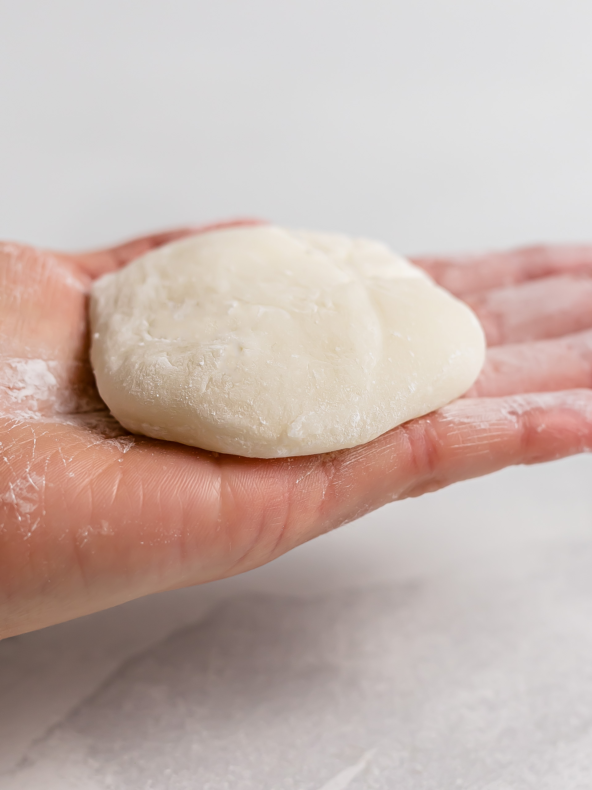 hand holding a mochi wrapper