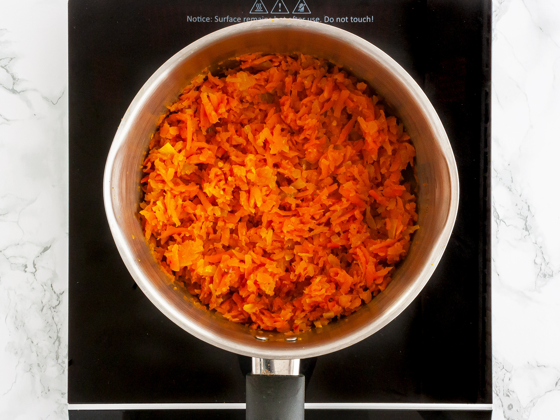 carrot chutney ingredients simmering in a pot