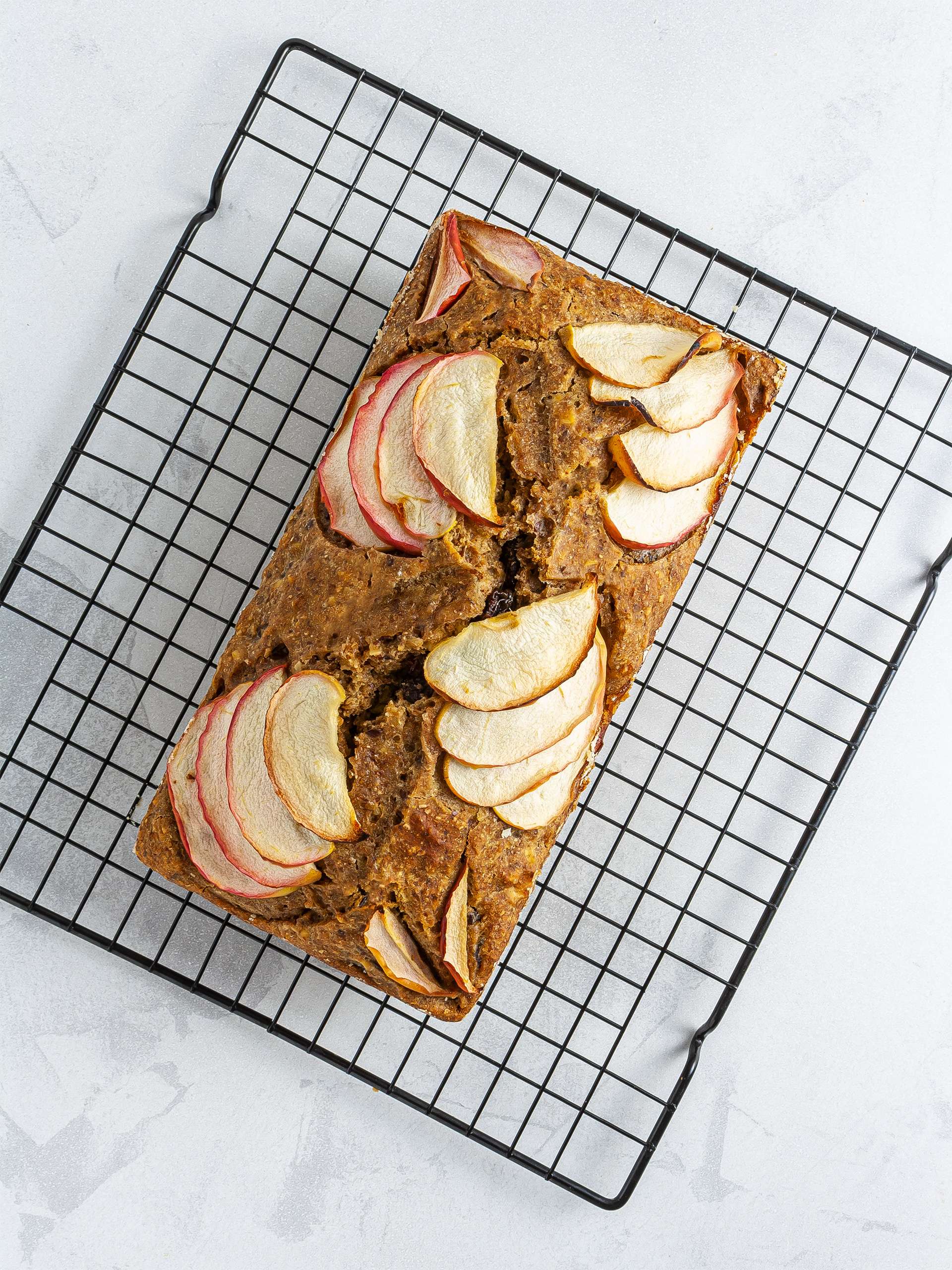 Baked apple cake bread on wire rack