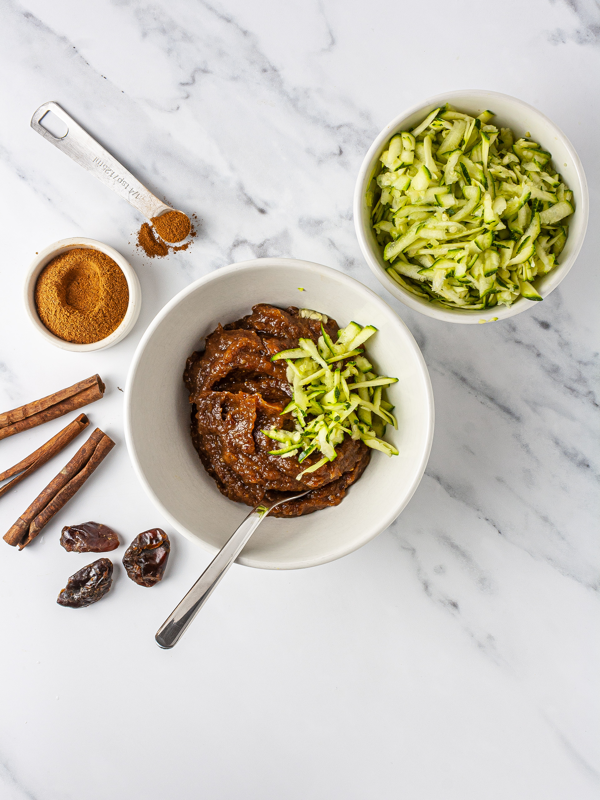 Date paste, grated zucchini, and cinnamon.