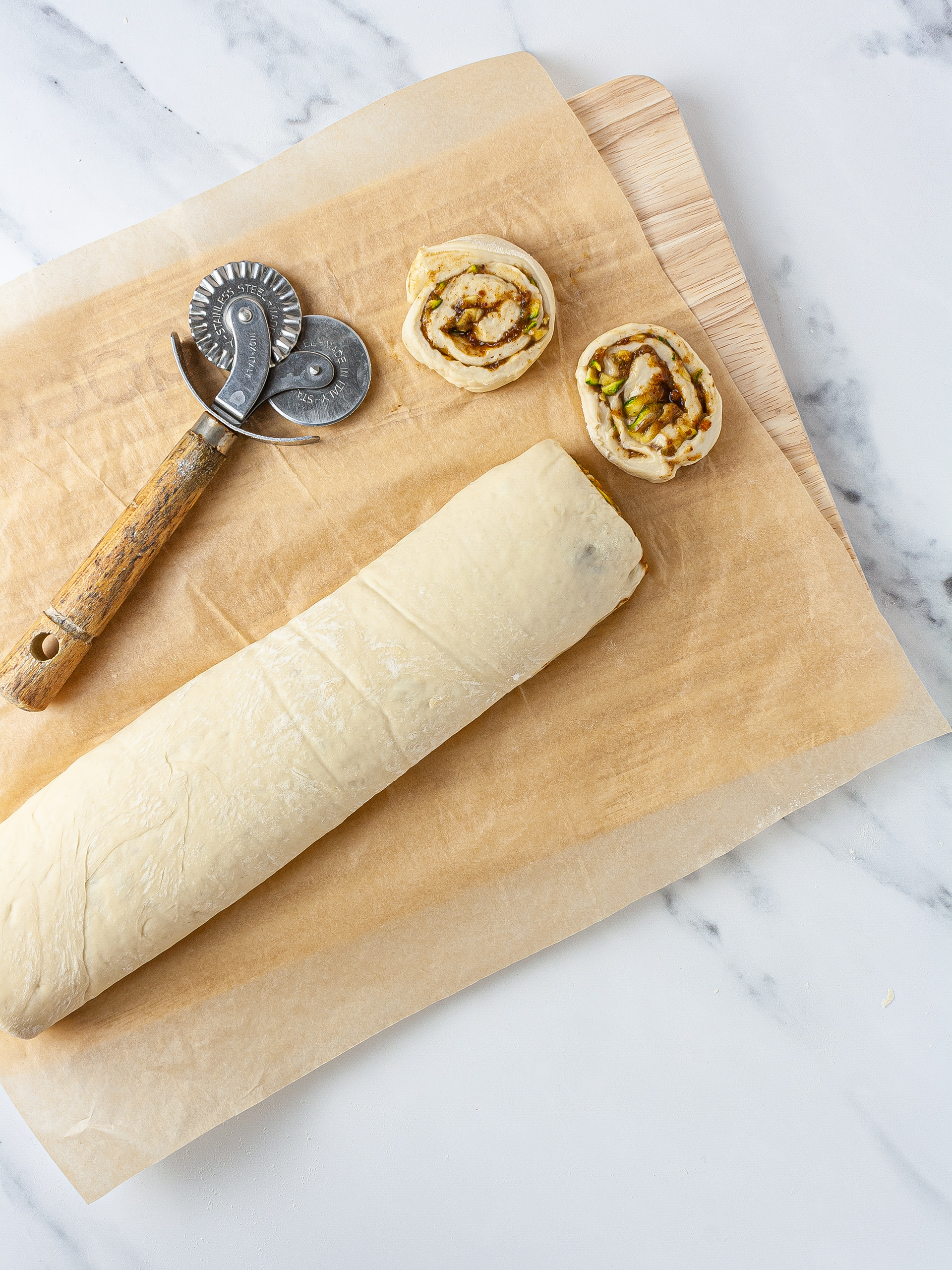 Cinnamon bun dough rolled and cut. 