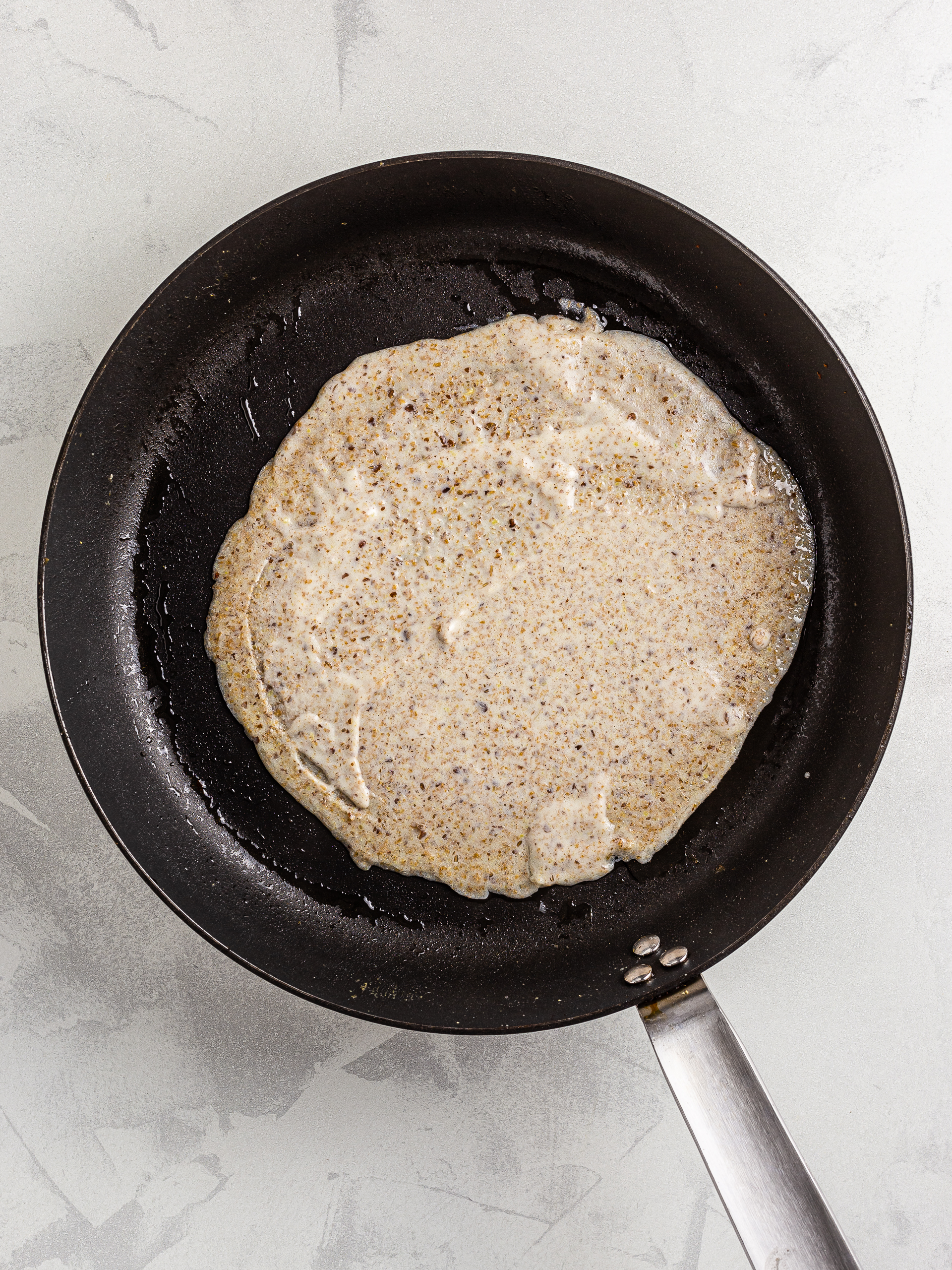 almond milk crepe in a skillet