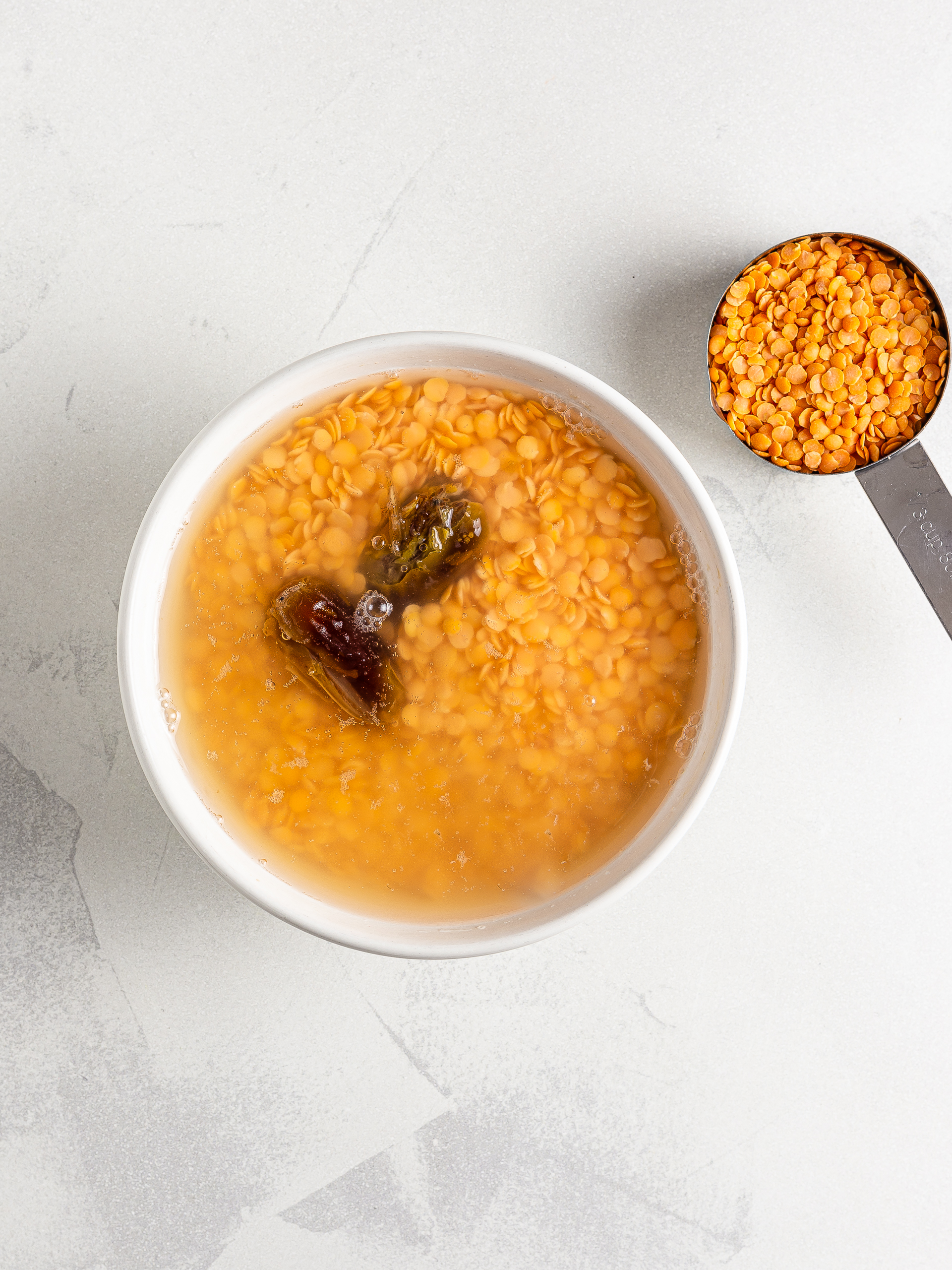 red lentils soaked in water with dates