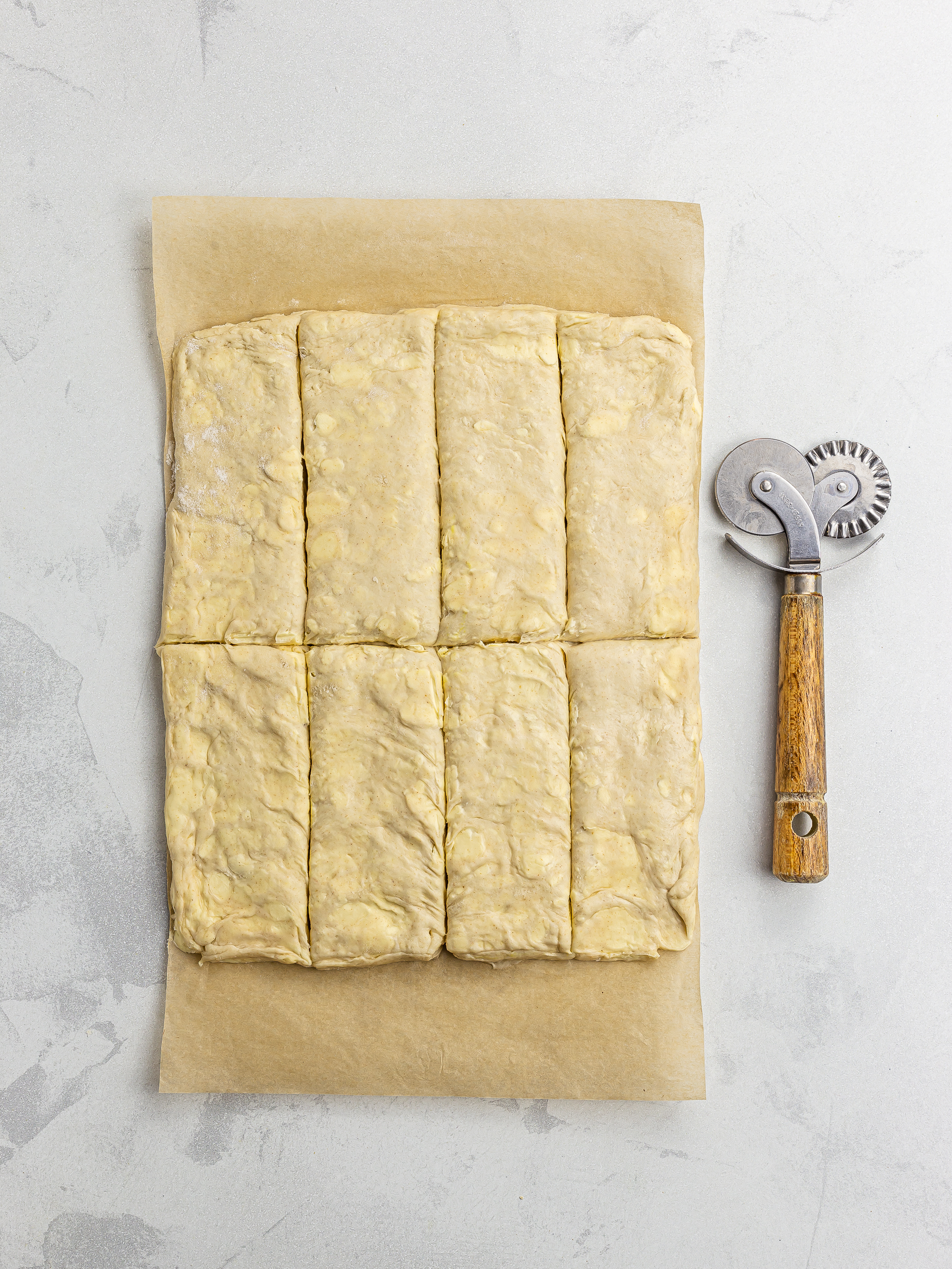 cut out pastry dough for pain au chocolat