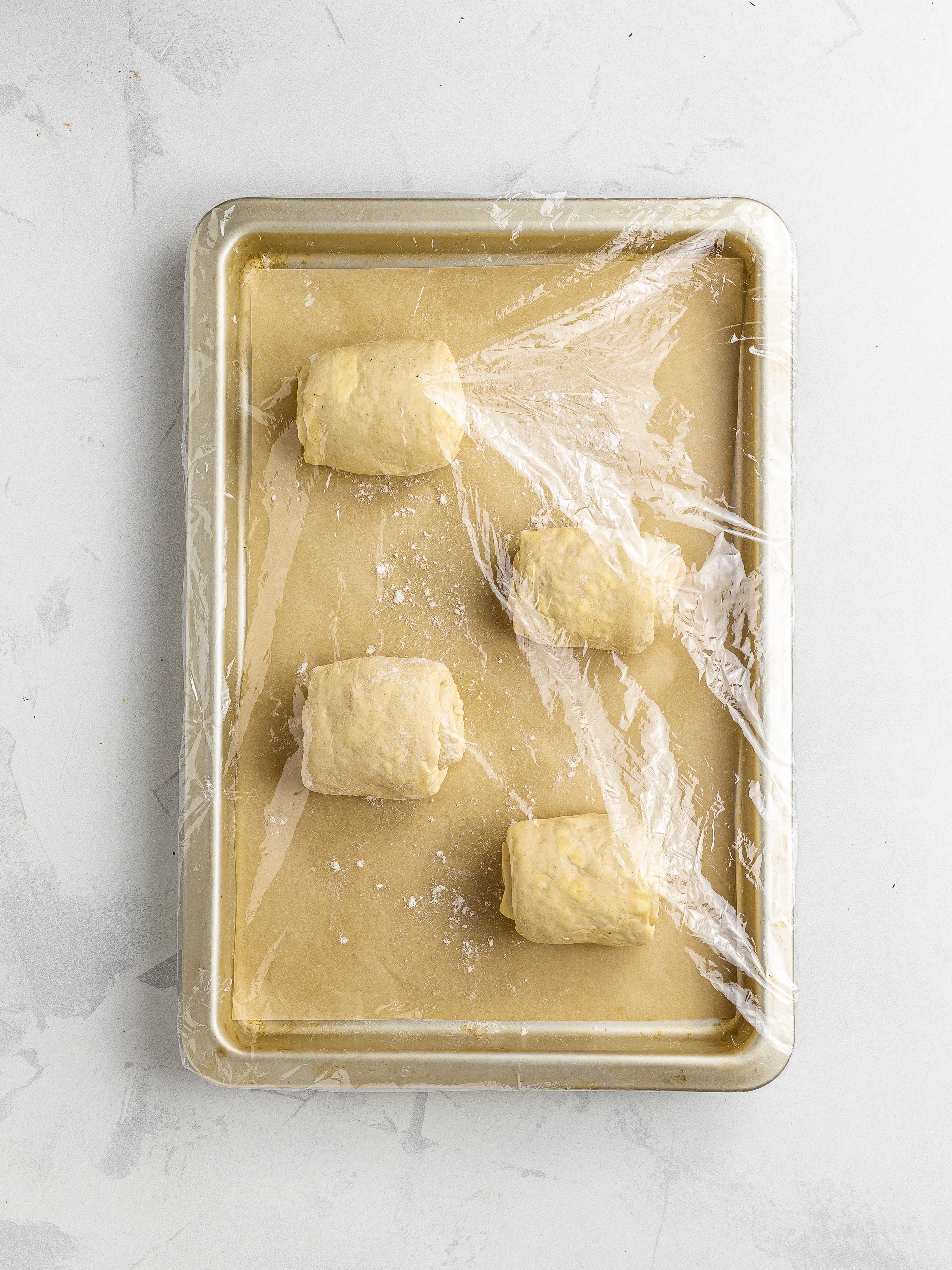 vegan pain au chocolate proving on a tray