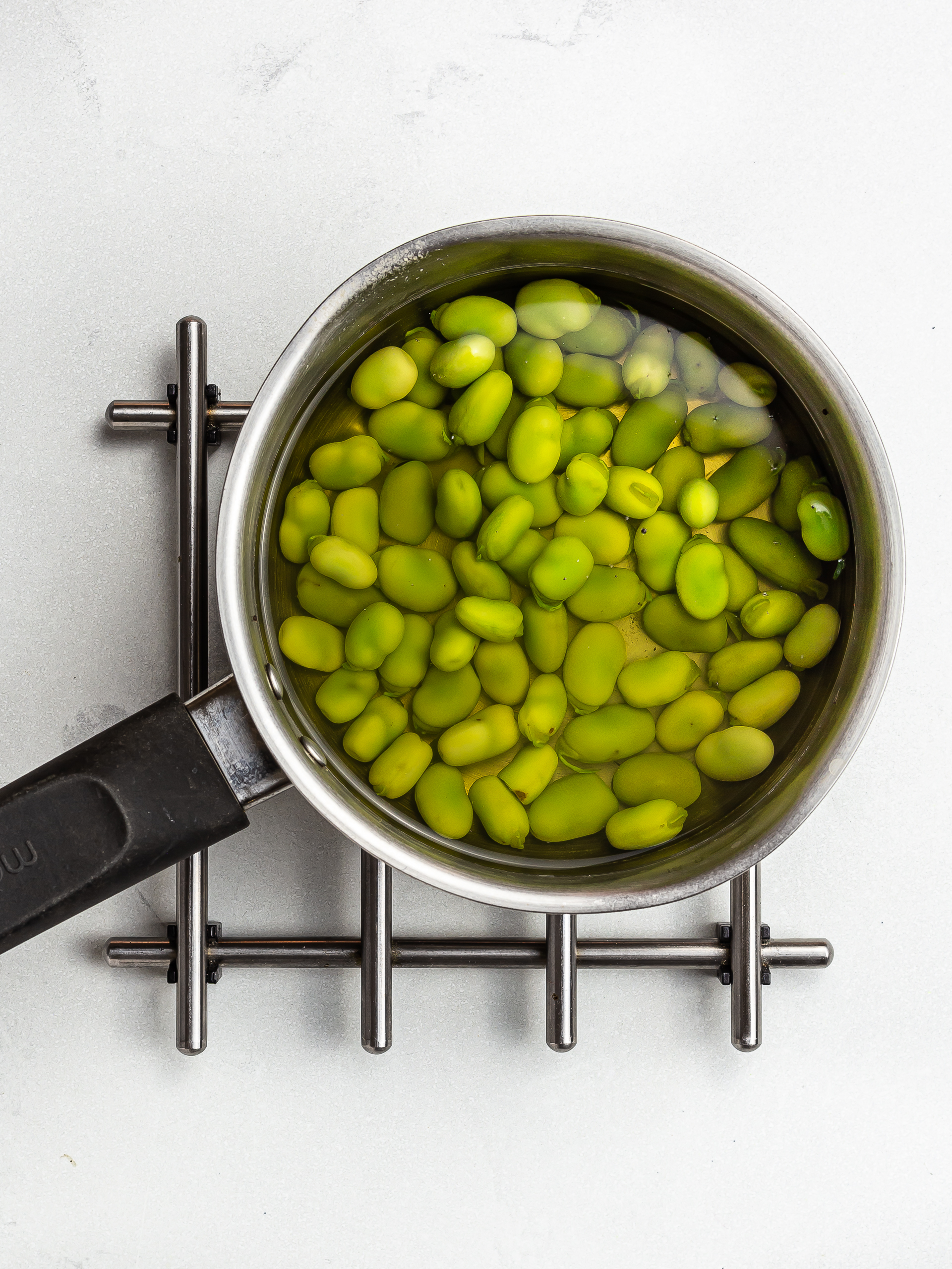 boiled broad beans in a pot