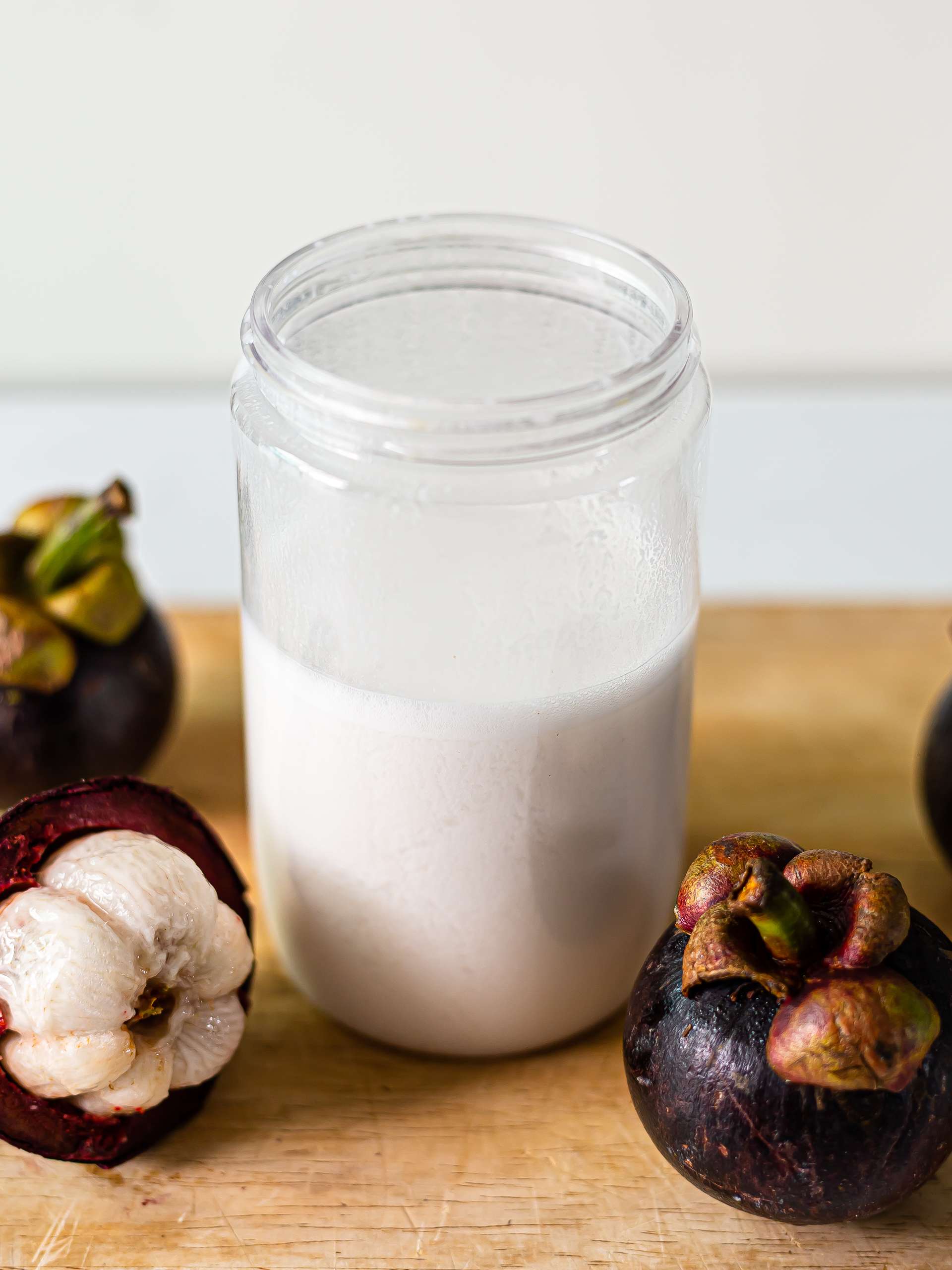mangosteen coconut smoothie in a jar