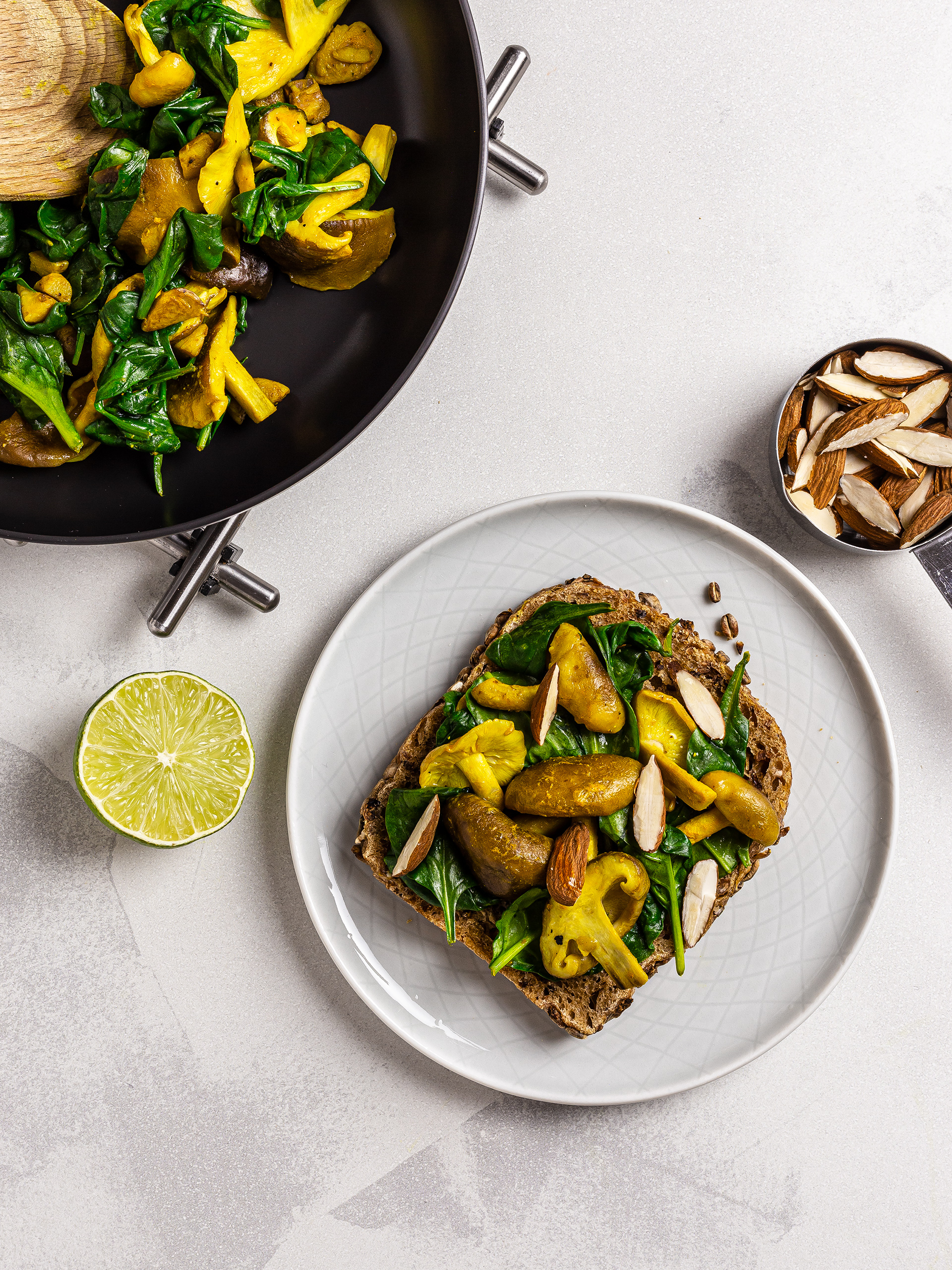 Sourdough toast with spinach, mushrooms and almonds