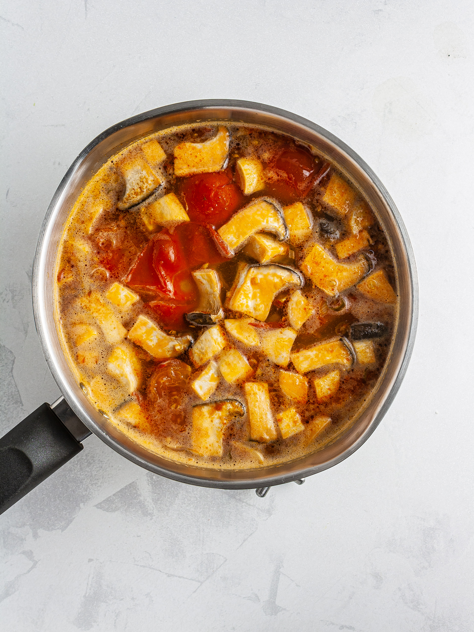 Tomatoes and mushroom in fish stock