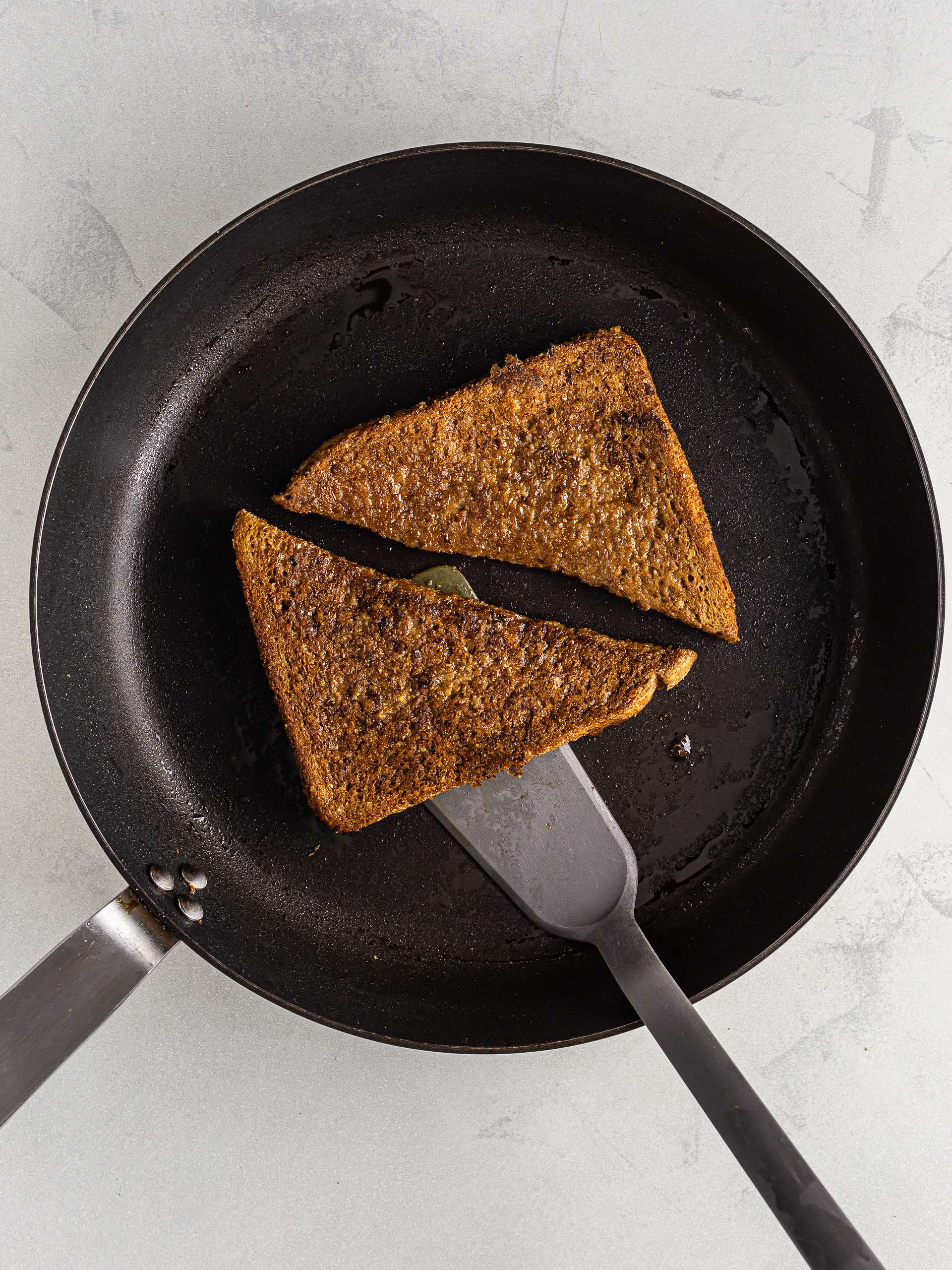 vegan coffee french toast cooked in a skillet