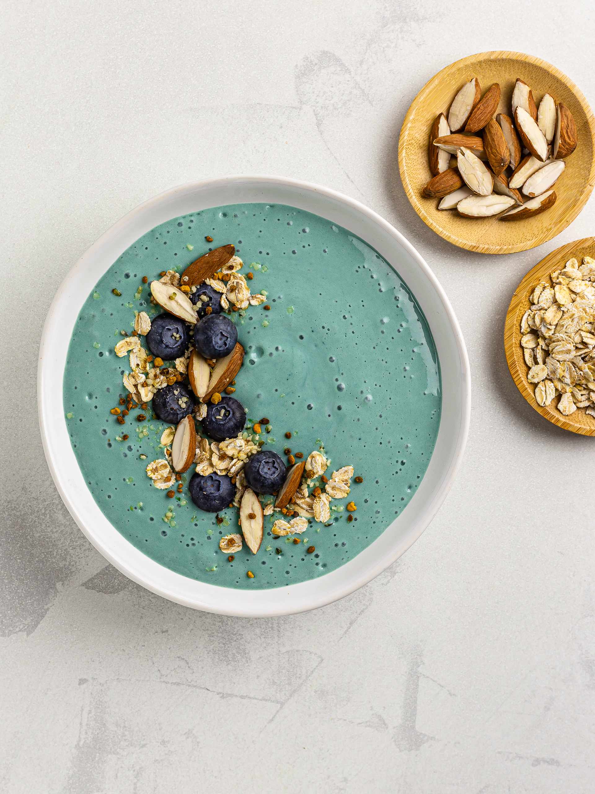 blue spirulina smoothie with oats, almonds, and blueberries