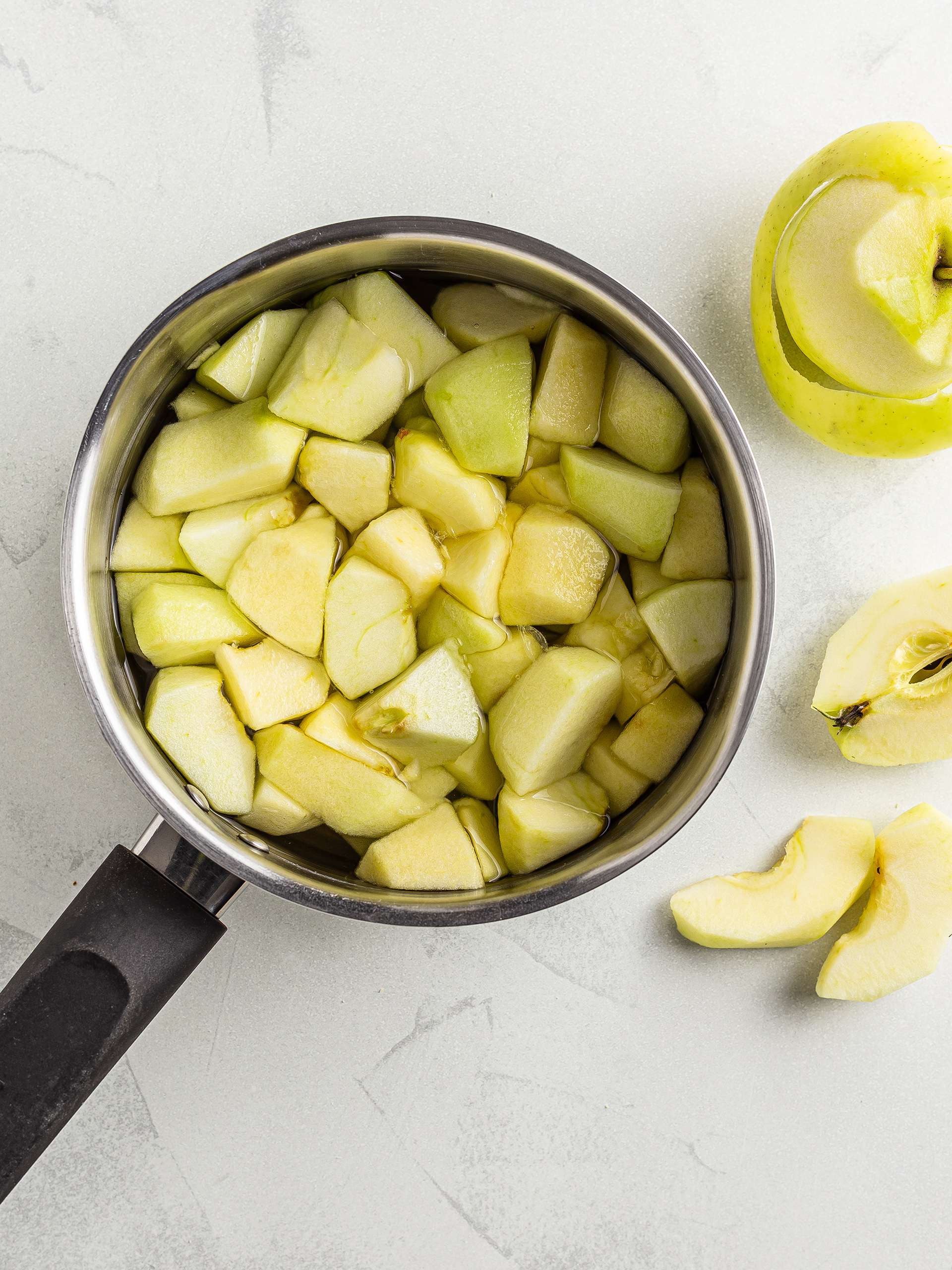 chopped apples in a pot for applesauce