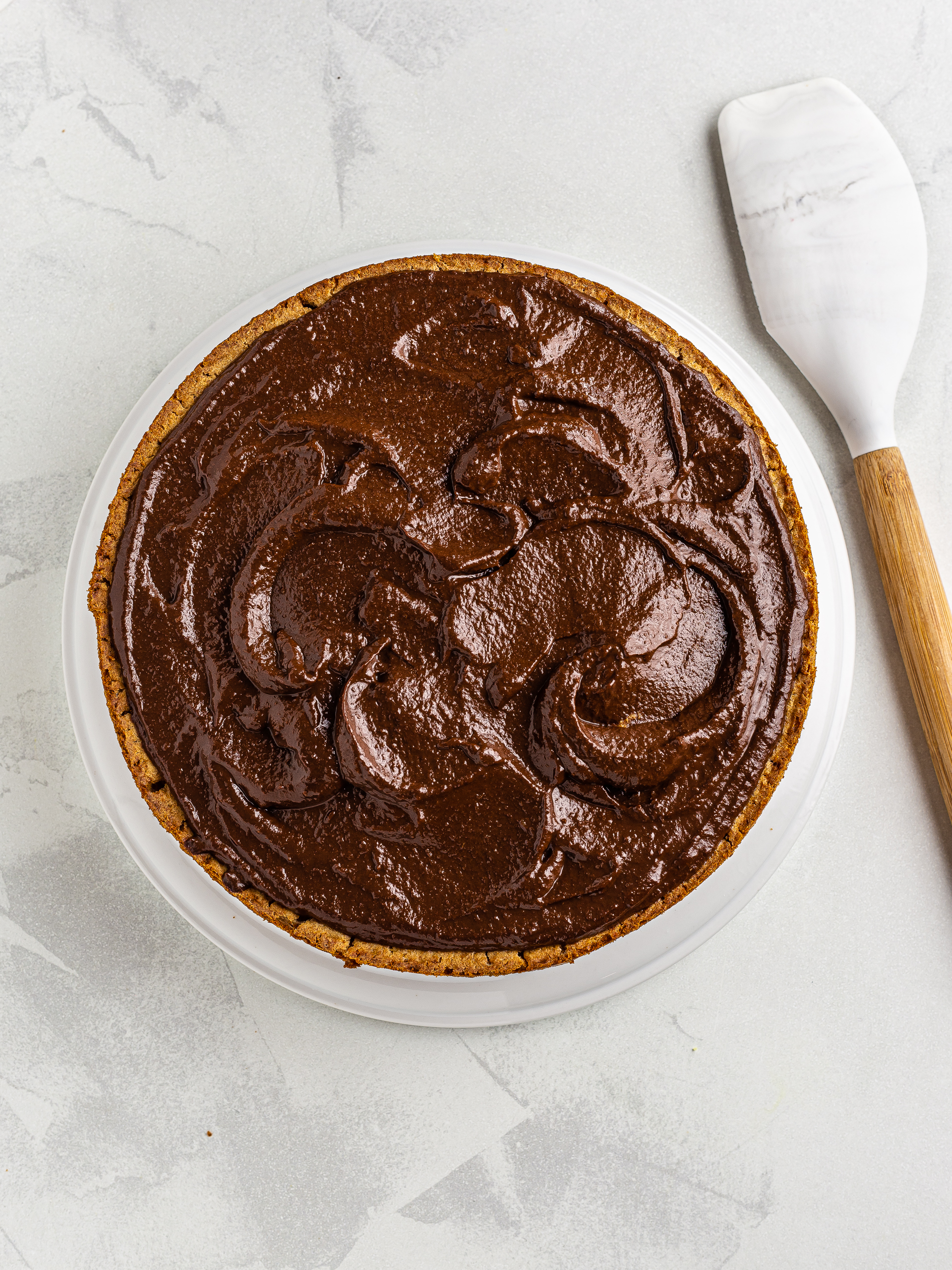 vegan applesauce cake with dark chocolate applesauce frosting
